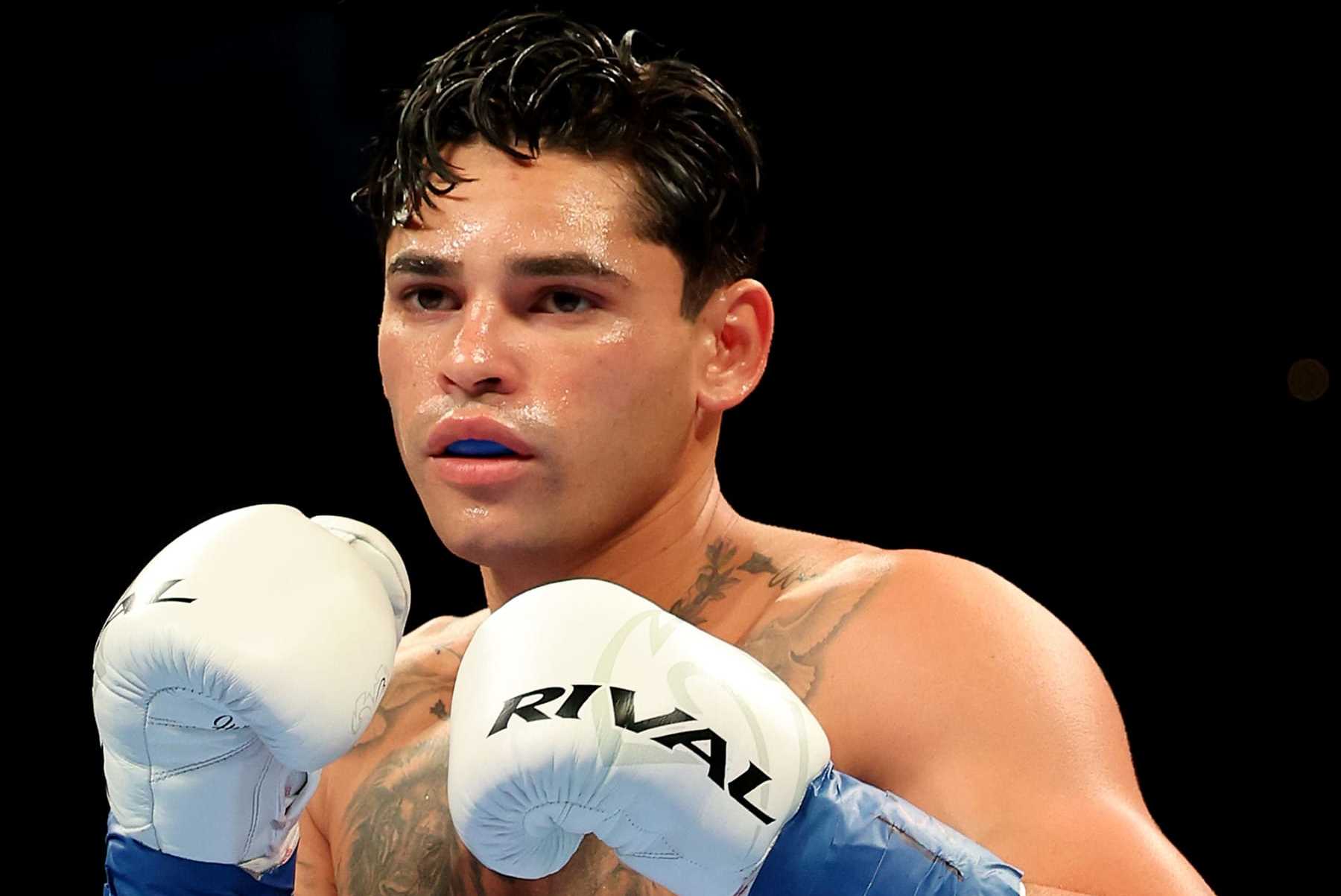 NEW YORK, NEW YORK - APRIL 20: Ryan Garcia (white trunks) prepares to fight Devin Haney during their WBC Super Lightweight title bout at Barclays Center on April 20, 2024 in New York City.  (Photo by Al Bello/Getty Images)