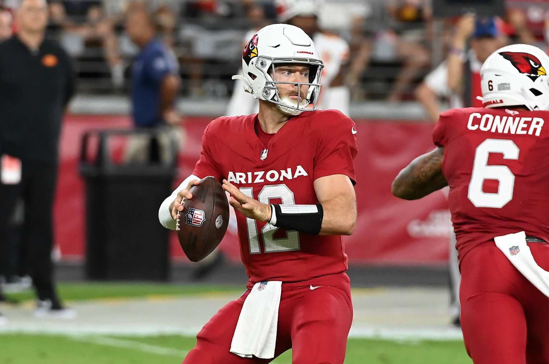 GLENDALE, ARIZONA - AUGUST 19: Colt McCoy #12 of the Arizona Cardinals looks to throw a pass during the first quarter of a preseason game against the Kansas City Chiefs at State Farm Stadium on August 19, 2023 in Glendale, Arizona. (Photo by Norm Hall/Getty Images)
