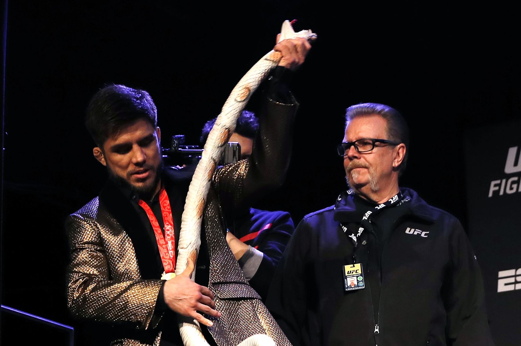 NEW YORK, NEW YORK - JANUARY 17: Henry Cejudo holds opens the gift from TJ Dillashaw during the press conference ahead of UFC Fight Night Cejudo v Dillashaw at the Music Hall of Williamsburg on January 17, 2019 in the Brooklyn borough of New York City. (Photo by Michael Owens/Zuffa LLC/Zuffa LLC)
