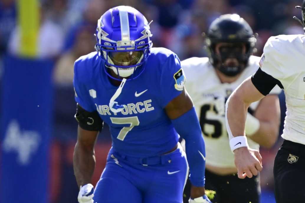 DENVER, CO - NOVEMBER 04: Army Black Knights quarterback Bryson Daily (13) eludes Air Force Falcons safety Trey Taylor (7) and heads to the end zone for a touchdown in the first quarter at Empower Field at Mile High Stadium November 04, 2023. (Photo by Andy Cross/MediaNews Group/The Denver Post via Getty Images)