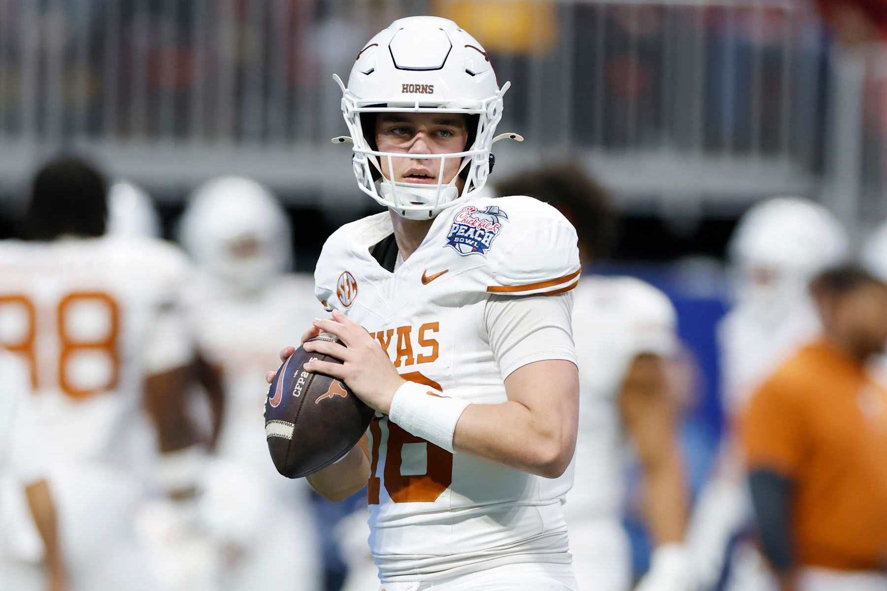 ATLANTA, GA - JANUARY 01: Quarterback Arch Manning #16 of the Texas Longhorns warms up before the Texas Longhorns versus Arizona State Sun Devils College Football Playoff Quarterfinal at the Chick-fil-A Peach Bowl on January 01, 2025, at Mercedes-Benz Stadium in Atlanta, GA. (Photo by Joe Robbins/Icon Sportswire via Getty Images)