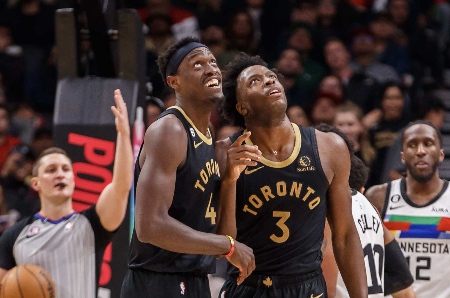 TORONTO, ON - MARCH 18: Pascal Siakam #43 and O.G. Anunoby #3 of the Toronto Raptors watch a replay of Anuoby's dunk on the big screen during the first half of their NBA game against the Minnesota Timberwolves at Scotiabank Arena on March 18, 2023 in Toronto, Canada. NOTE TO USER: User expressly acknowledges and agrees that, by downloading and or using this photograph, User is consenting to the terms and conditions of the Getty Images License Agreement. (Photo by Cole Burston/Getty Images)