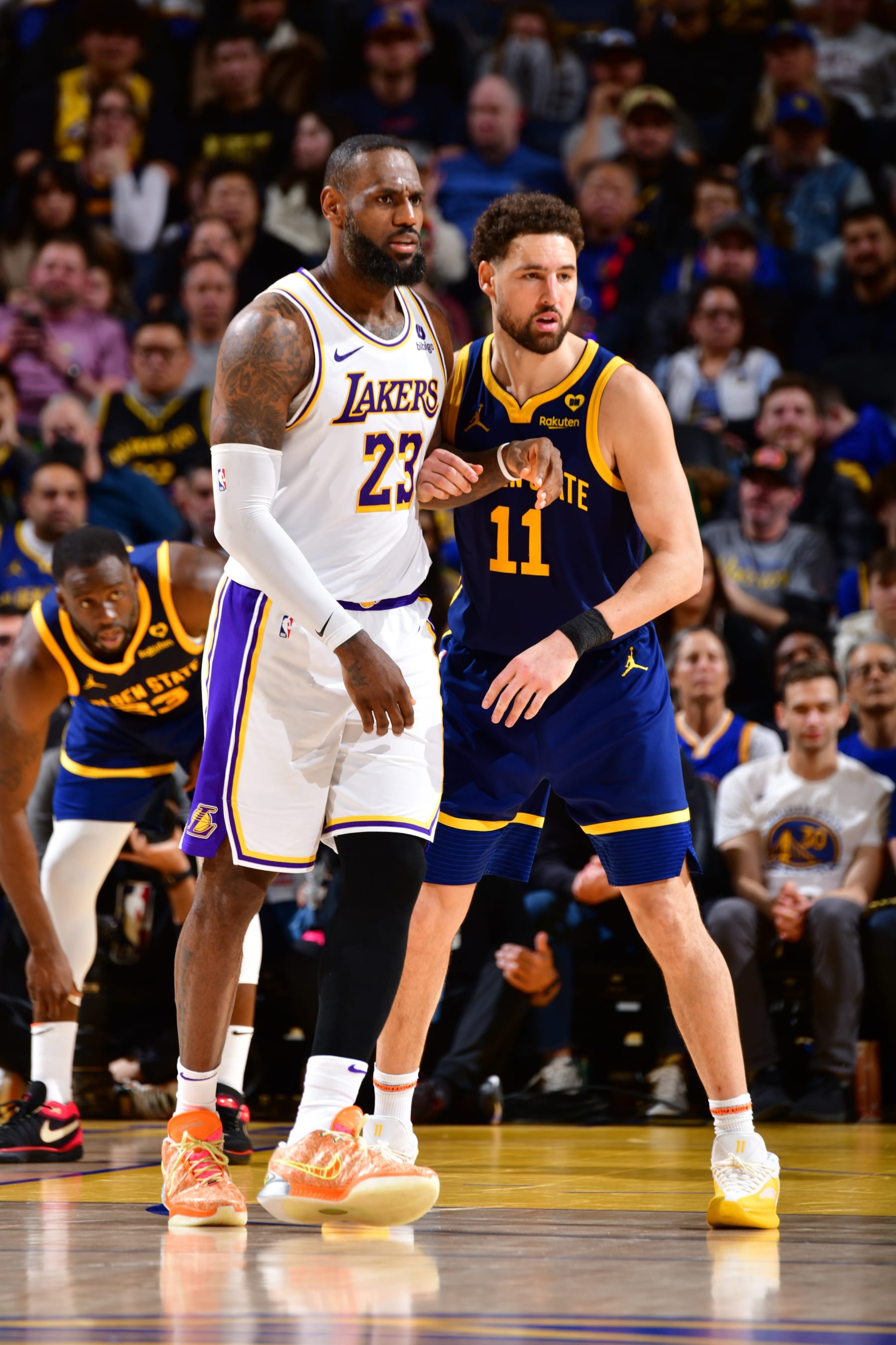 SAN FRANCISCO, CA - JANUARY 27:  LeBron James #23 of the Los Angeles Lakers and Klay Thompson #11 of the Golden State Warriors looks on during the game on January 27, 2024 at Chase Center in San Francisco, California. NOTE TO USER: User expressly acknowledges and agrees that, by downloading and or using this photograph, user is consenting to the terms and conditions of Getty Images License Agreement. Mandatory Copyright Notice: Copyright 2024 NBAE (Photo by Barry Gossage/NBAE via Getty Images)