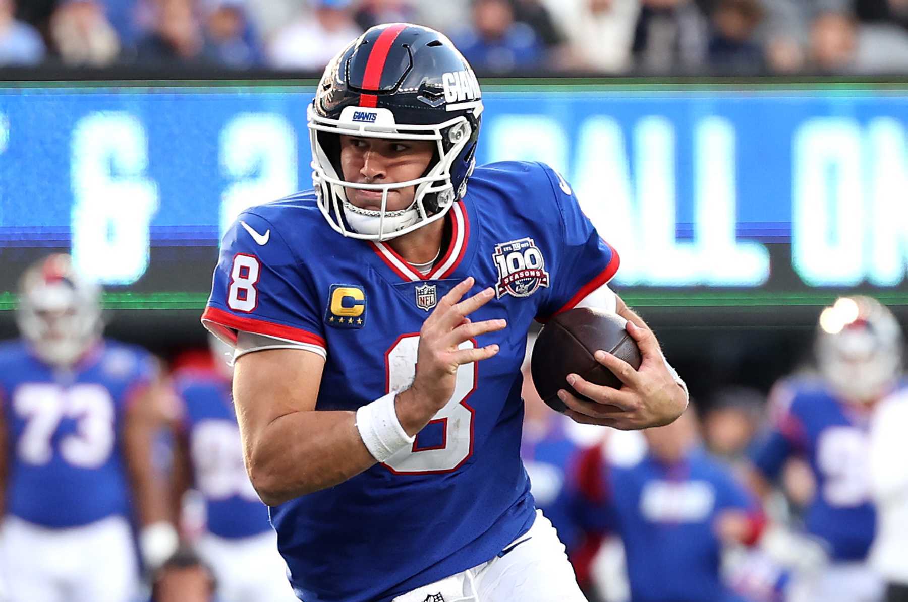 EAST RUTHERFORD, NEW JERSEY - NOVEMBER 03: Daniel Jones #8 of the New York Giants runs in a touchdown during the fourth quarter against the Washington Commanders at MetLife Stadium on November 03, 2024 in East Rutherford, New Jersey. (Photo by Luke Hales/Getty Images)