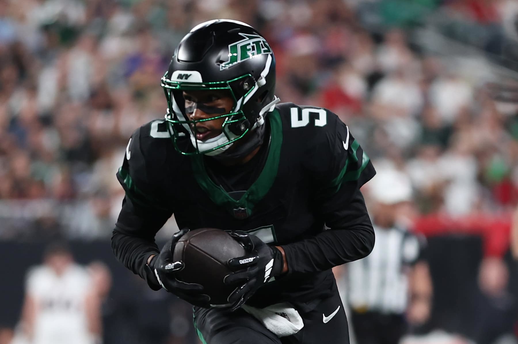 EAST RUTHERFORD, NEW JERSEY - OCTOBER 31: Garrett Wilson #5 of the New York Jets scores a touchdown during the third quarter against the Houston Texans at MetLife Stadium on October 31, 2024 in East Rutherford, New Jersey. (Photo by Sarah Stier/Getty Images)
