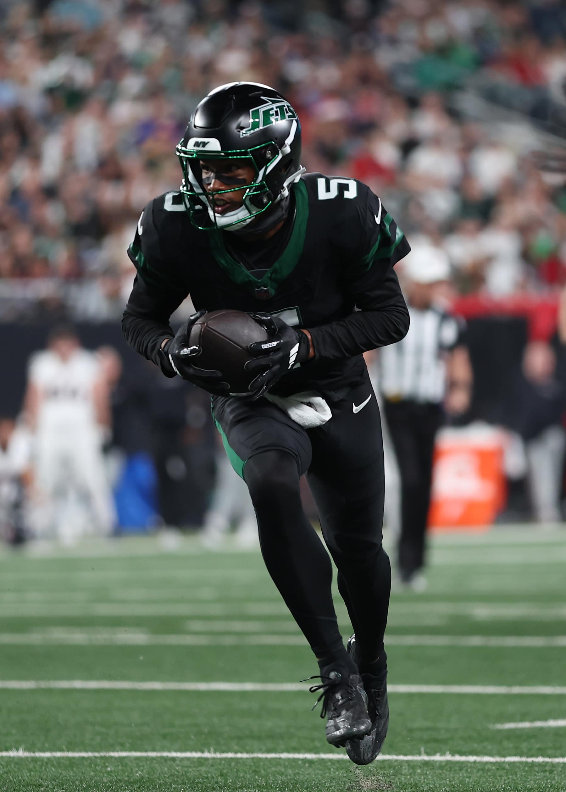 EAST RUTHERFORD, NEW JERSEY - OCTOBER 31: Garrett Wilson #5 of the New York Jets scores a touchdown during the third quarter against the Houston Texans at MetLife Stadium on October 31, 2024 in East Rutherford, New Jersey. (Photo by Sarah Stier/Getty Images)