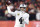 Las Vegas Raiders quarterback Derek Carr (4) throws a pass in the second half during an NFL wild-card playoff football game against the Cincinnati Bengals, Saturday, Jan. 15, 2022, in Cincinnati. (AP Photo/Emilee Chinn)