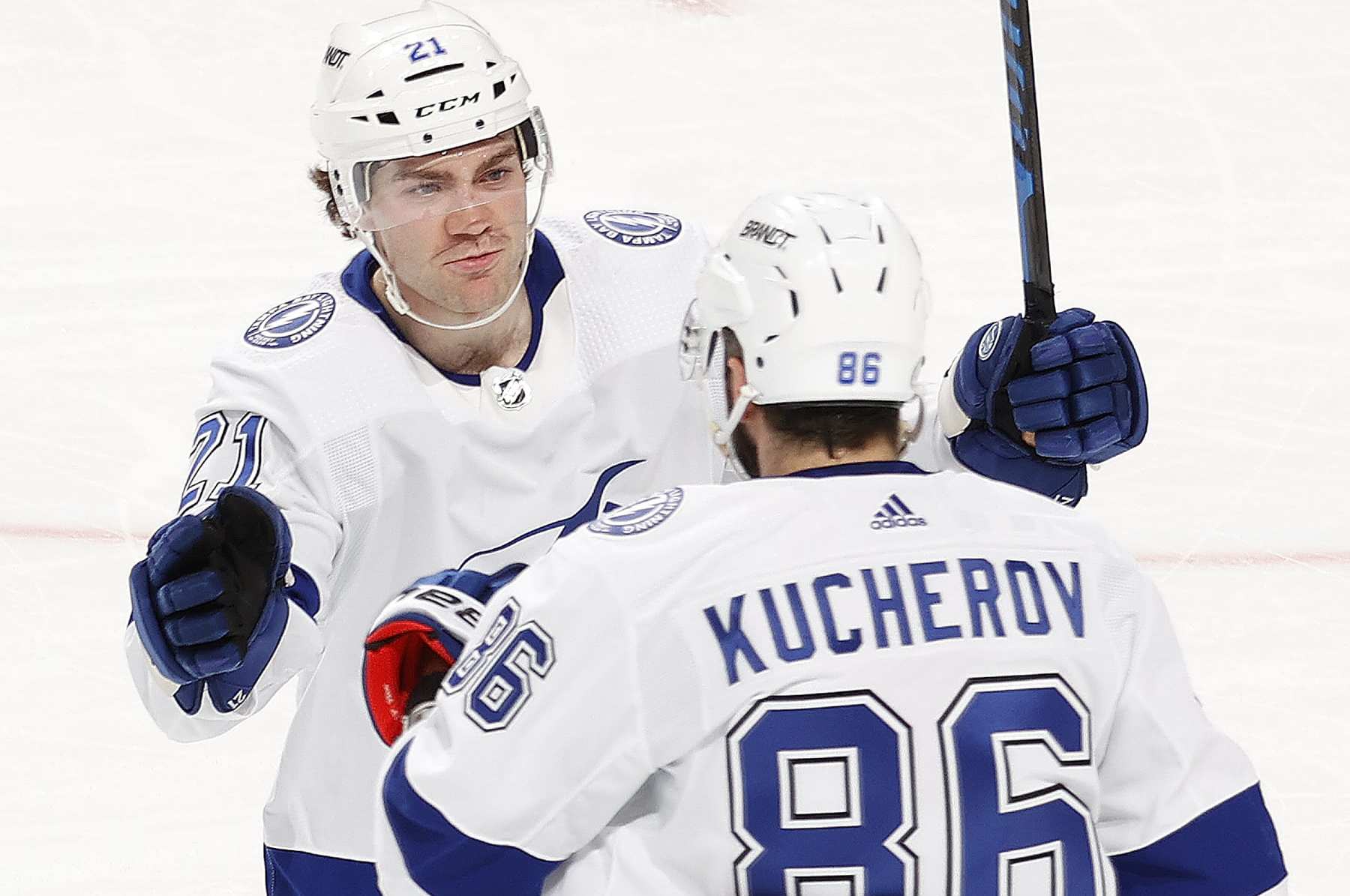 SUNRISE, FL - MARCH 16: Nikita Kucherov #86 is congratulated by Brayden Point #21 of the Tampa Bay Lightning after he scored an empty net goal against the Florida Panthers at the Amerant Bank Arena on March 16, 2024 in Sunrise, Florida. (Photo by Joel Auerbach/Getty Images)