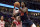 Julius Randle (30) of the New York Knicks drives to the basket and is fouled by Patrick Williams of the Chicago Bulls during the first half of an NBA basketball game Wednesday, December 14, 2022 in Chicago.  (AP Photo/Charles Rex Arbogast)