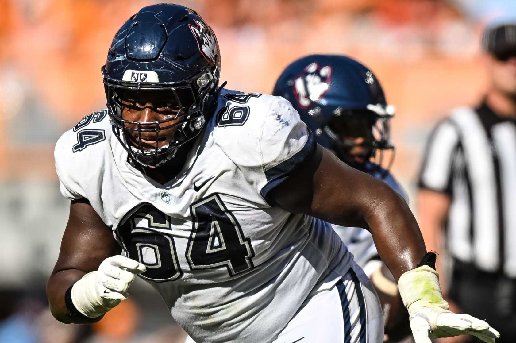 KNOXVILLE, TN - NOVEMBER 04: Connecticut Huskies offensive lineman Christian Haynes (64) blocks during the college football game between the Tennessee Volunteers and the Connecticut Huskies on November 4, 2023, at Neyland Stadium, in Knoxville, TN. (Photo by Bryan Lynn/Icon Sportswire via Getty Images)