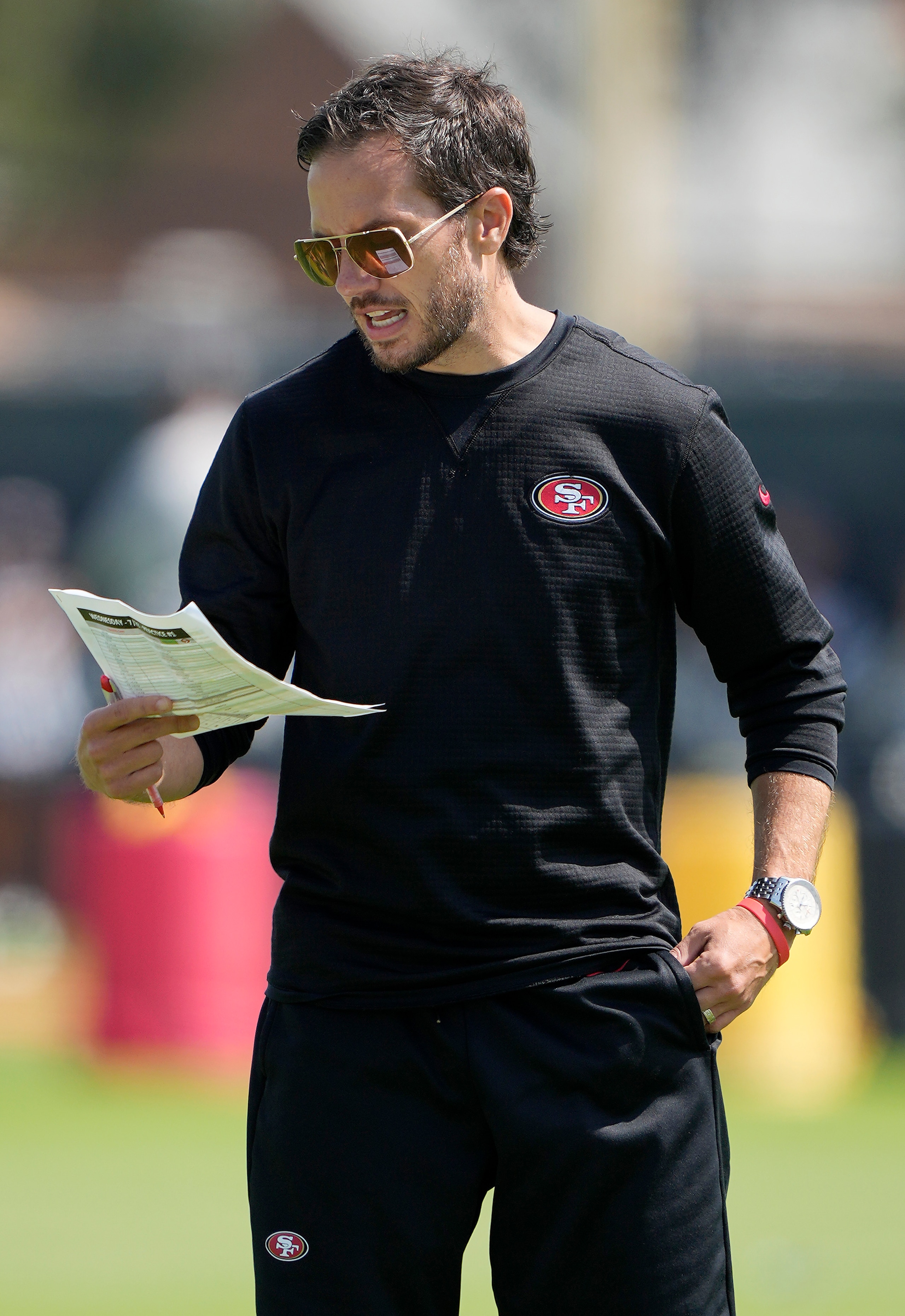 SANTA CLARA, CALIFORNIA - JULY 28: Offensive Coordinator Mike McDaniel of the San Francisco 49ers watches works outs during training camp at SAP Performance Facility on July 28, 2021 in Santa Clara, California. (Photo by Thearon W. Henderson/Getty Images) SANTA CLARA, CALIFORNIA - JULY 28: Offensive Coordinator Mike McDaniel of the San Francisco 49ers watches works outs during training camp at SAP Performance Facility on July 28, 2021 in Santa Clara, California. (Photo by Thearon W. Henderson/Getty Images)
