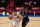 PHILADELPHIA, PA - APRIL 21: Devin Booker #1 of the Phoenix Suns dribbles the ball against Matisse Thybulle #22 of the Philadelphia 76ers in the third quarter at the Wells Fargo Center on April 21, 2021 in Philadelphia, Pennsylvania. NOTE TO USER: User expressly acknowledges and agrees that, by downloading and or using this photograph, User is consenting to the terms and conditions of the Getty Images License Agreement. (Photo by Mitchell Leff/Getty Images)