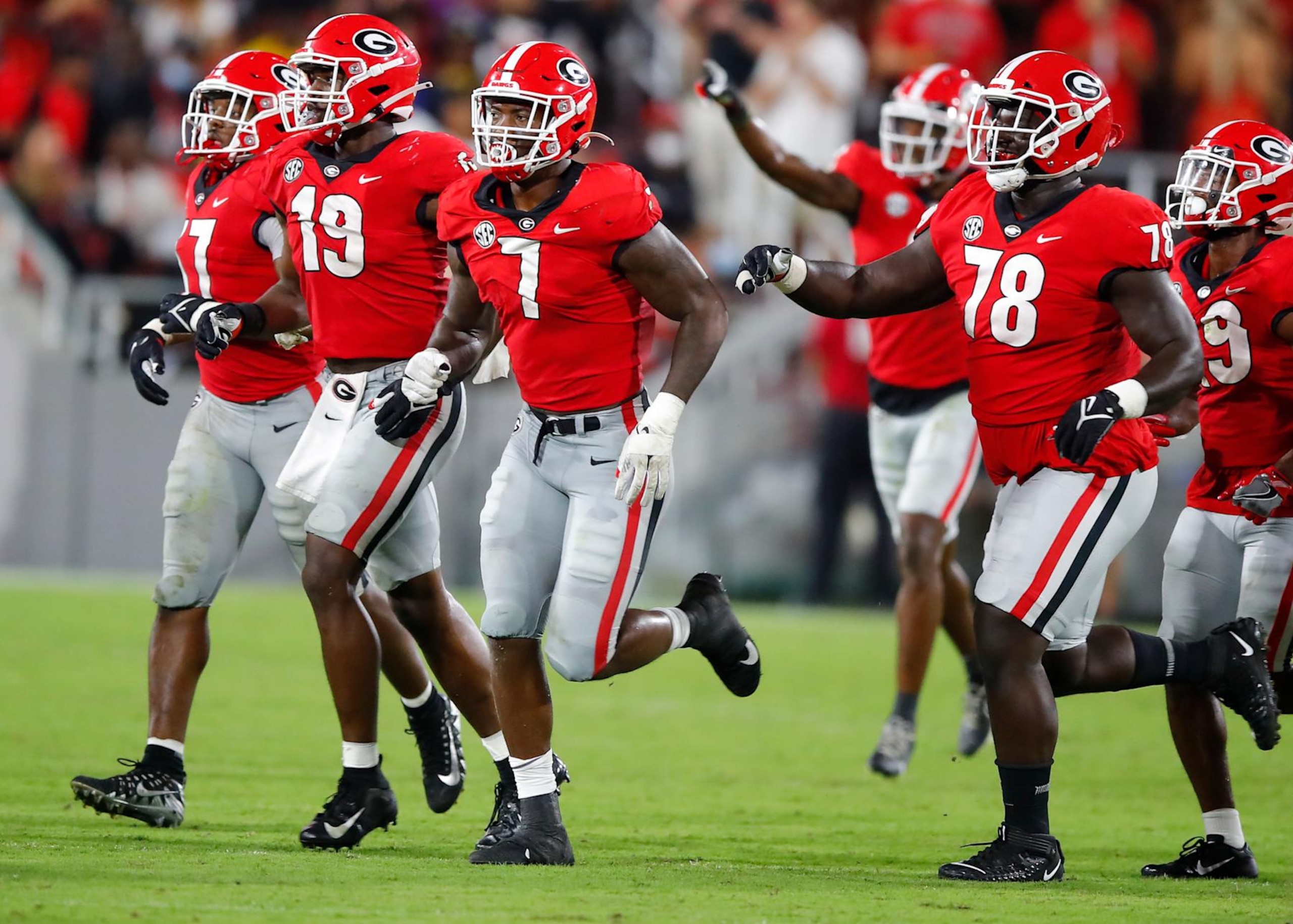 ATHENS, GA - SEPTEMBER 18: Quay Walker #7 of the Georgia Bulldogs reacts with teammates after he recovers a fumble in the second half against the South Carolina Gamecocks at Sanford Stadium on September 18, 2021 in Athens, Georgia. (Photo by Todd Kirkland/Getty Images)