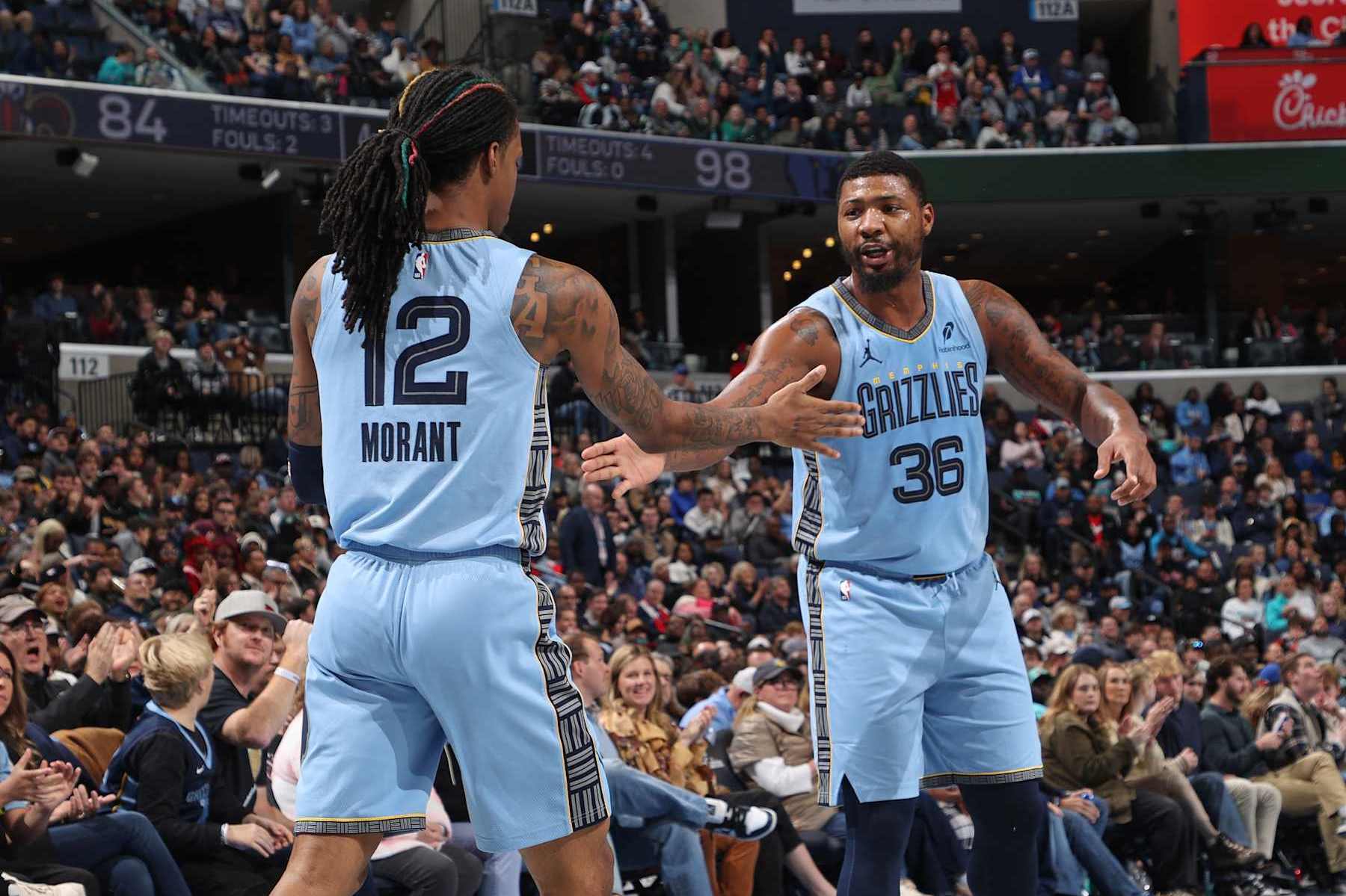 MEMPHIS, TN - NOVEMBER 29: Ja Morant #12 and Marcus Smart #36 of the Memphis Grizzlies high five during the game against the New Orleans Pelicans during the Emirates NBA Cup game on November 29, 2024 at FedExForum in Memphis, Tennessee. NOTE TO USER: User expressly acknowledges and agrees that, by downloading and or using this photograph, User is consenting to the terms and conditions of the Getty Images License Agreement. Mandatory Copyright Notice: Copyright 2024 NBAE (Photo by Joe Murphy/NBAE via Getty Images)
