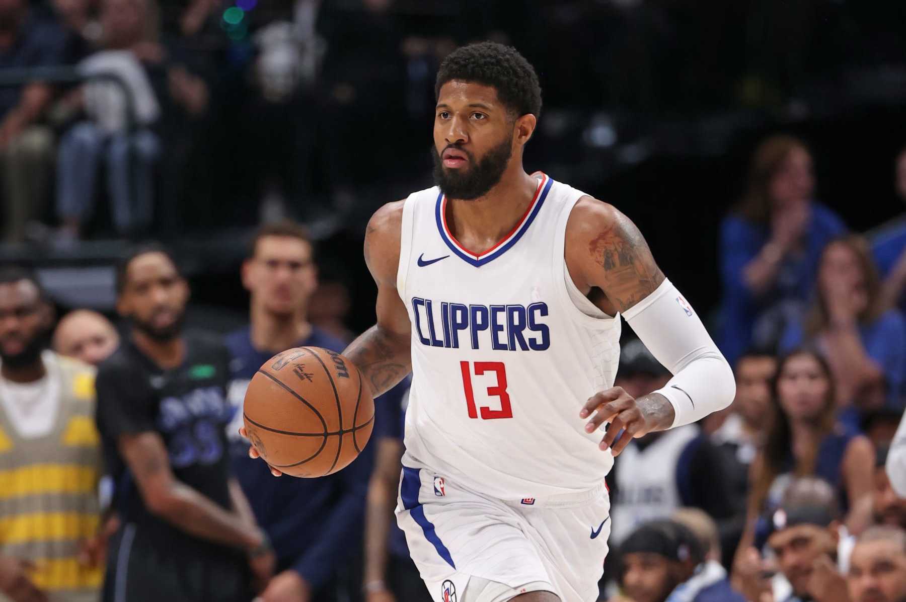DALLAS, TX - MAY 3: Paul George #13 of the LA Clippers dribbles the ball during the game against the Dallas Mavericks during Round 1 Game 6 of the 2024 NBA Playoffs on May 3, 2024 at the American Airlines Center in Dallas, Texas. NOTE TO USER: User expressly acknowledges and agrees that, by downloading and or using this photograph, User is consenting to the terms and conditions of the Getty Images License Agreement. Mandatory Copyright Notice: Copyright 2024 NBAE (Photo by Joe Murphy/NBAE via Getty Images)