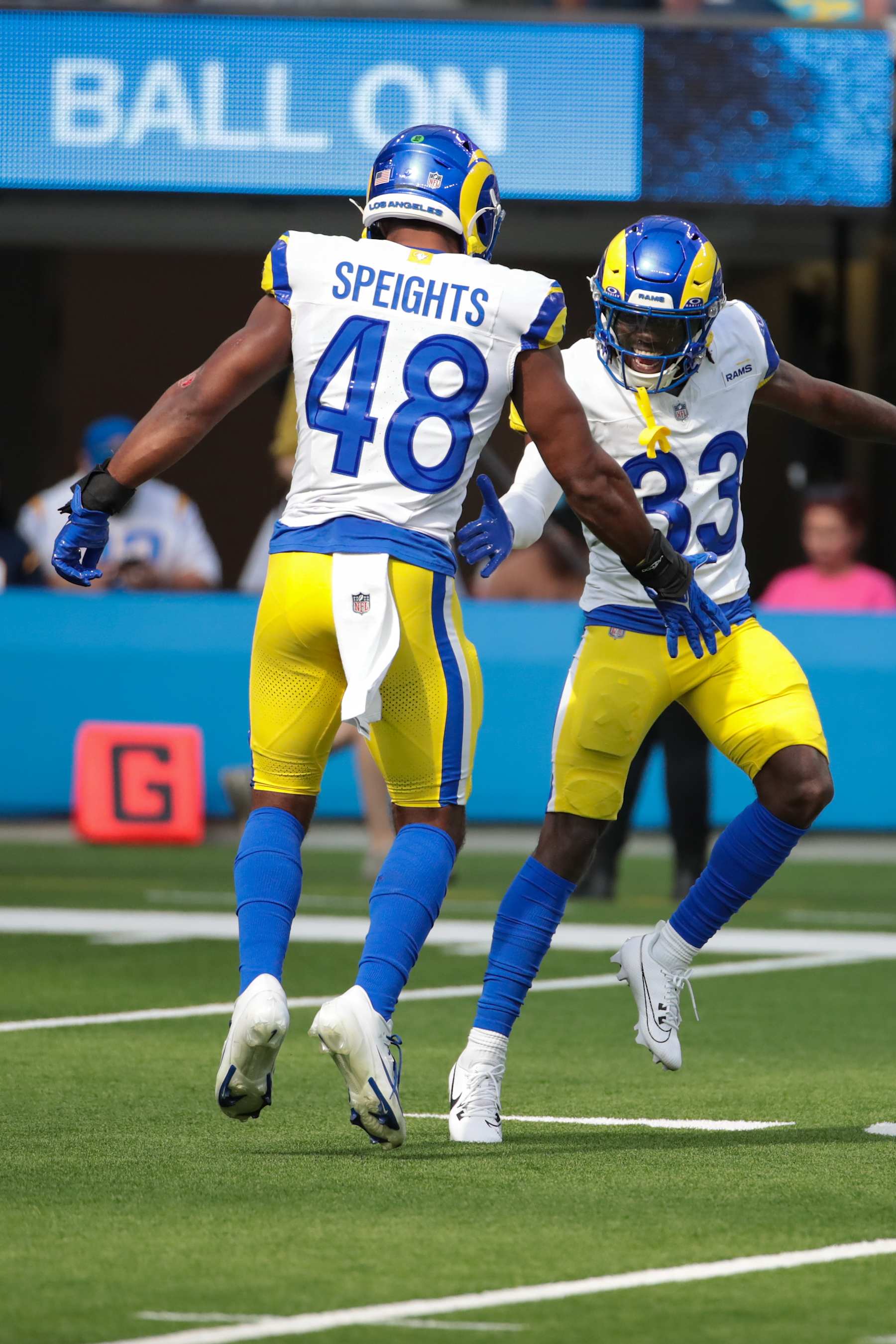 INGLEWOOD, CA - AUGUST 17: Los Angeles Rams linebacker Omar Speights (48) celebrates a tackle with Los Angeles Rams cornerback Cam Lampkin (33)  aduring the NFL preseason game between the Los Angeles Rams and the Los Angeles Chargers on August 17, 2024, at SoFi Stadium in Los Angeles. CA. (Photo by Jevone Moore/Icon Sportswire via Getty Images)