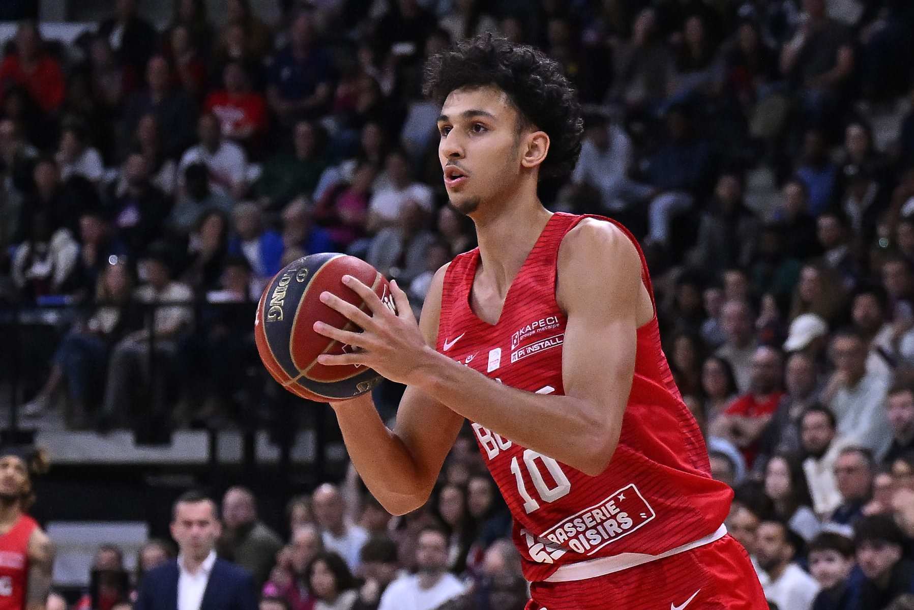 PARIS, FRANCE - APRIL 28: Zaccharie Risacher of Bourg en Bresse Basket runs with the ball during the Betclic Elite match between Paris and Bourg en Bresse Basket at Adidas Arena on April 28, 2024 in Paris, France. (Photo by Aurelien Meunier/Getty Images)