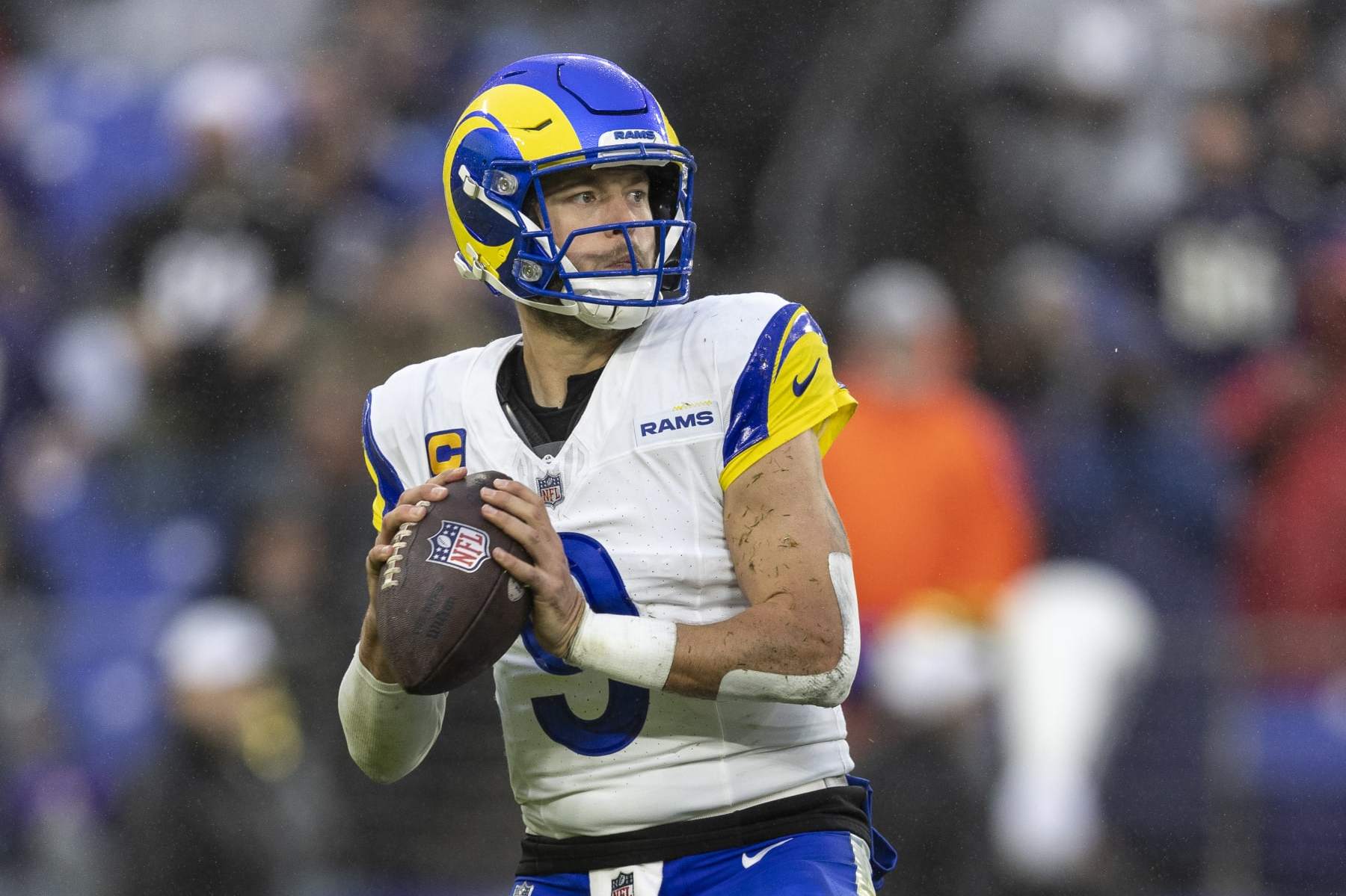 BALTIMORE, MARYLAND - DECEMBER 10: Matthew Stafford #9 of the Los Angeles Rams drops back and looks to pass during an NFL football game between the Baltimore Ravens and the Los Angeles Rams at M&T Bank Stadium on December 10, 2023 in Baltimore, Maryland. (Photo by Michael Owens/Getty Images)