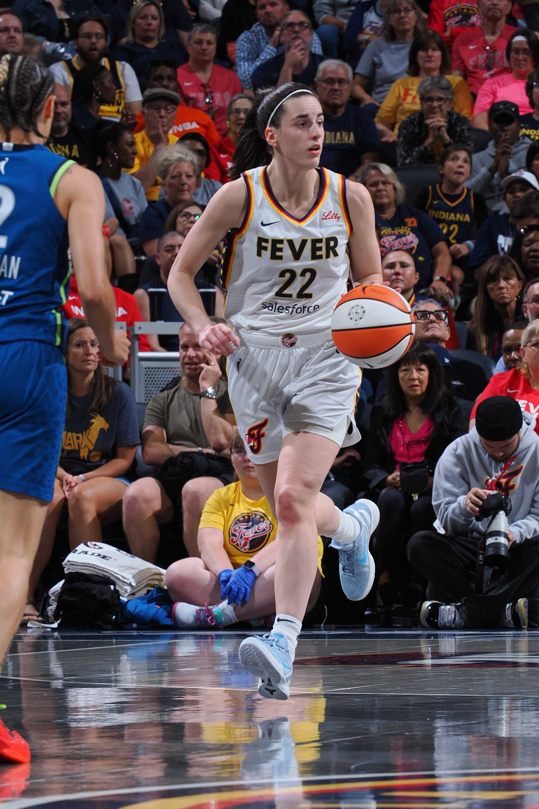 INDIANAPOLIS, IN - SEPTEMBER 6:  Caitlin Clark #22 of the Indiana Fever dribbles the ball during the game against the Minnesota Lynx on September 6, 2024 at Gainbridge Fieldhouse in Indianapolis, Indiana. NOTE TO USER: User expressly acknowledges and agrees that, by downloading and or using this Photograph, user is consenting to the terms and conditions of the Getty Images License Agreement. Mandatory Copyright Notice: Copyright 2024 NBAE (Photo by Ron Hoskins/NBAE via Getty Images)