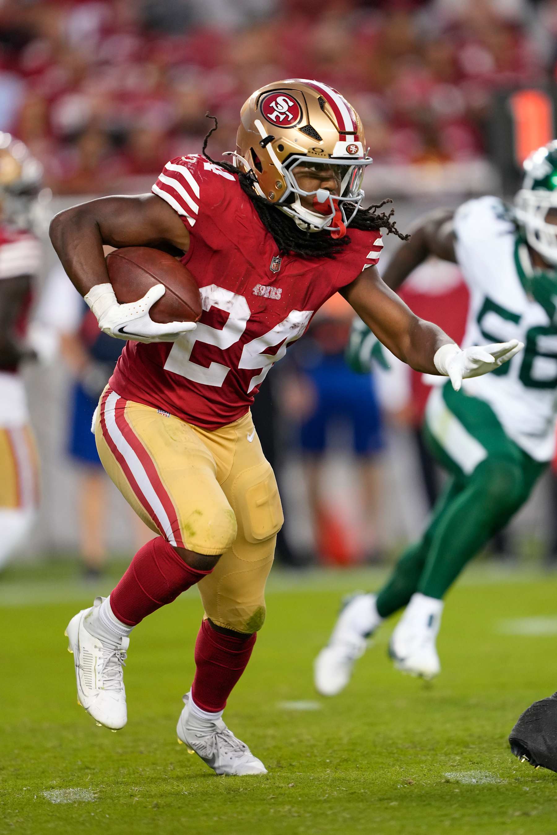 SANTA CLARA, CALIFORNIA - SEPTEMBER 09: Running back Jordan Mason #24 of the San Francisco 49ers carries the ball against the New York Jets during the third quarter at Levi's Stadium on September 09, 2024 in Santa Clara, California. (Photo by Thearon W. Henderson/Getty Images)