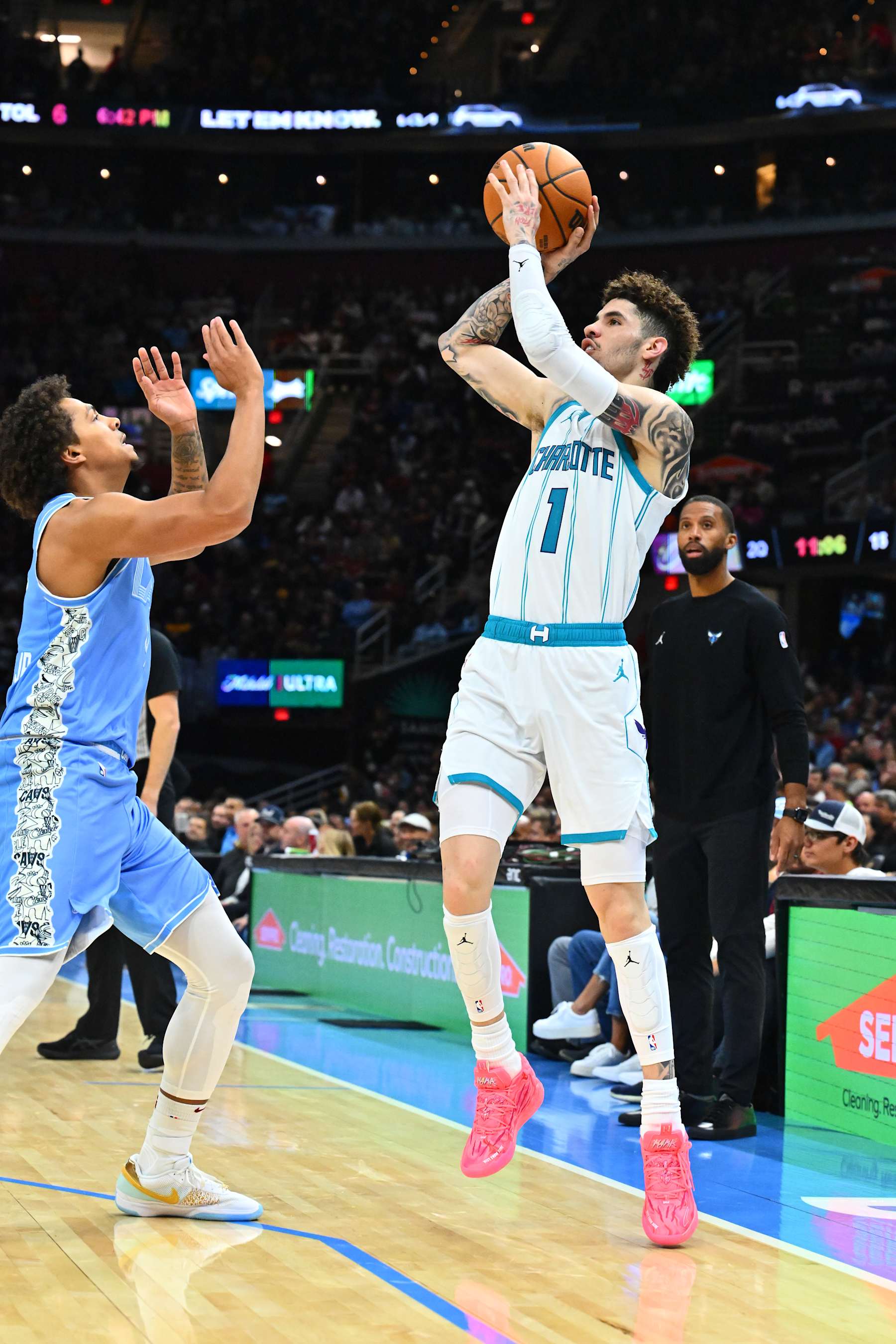 CLEVELAND, OHIO - NOVEMBER 17: LaMelo Ball #1 of the Charlotte Hornets shoots over Craig Porter Jr. #9 of the Cleveland Cavaliers at Rocket Mortgage Fieldhouse on November 17, 2024 in Cleveland, Ohio. NOTE TO USER: User expressly acknowledges and agrees that, by downloading and or using this photograph, User is consenting to the terms and conditions of the Getty Images License Agreement. (Photo by Jason Miller/Getty Images)