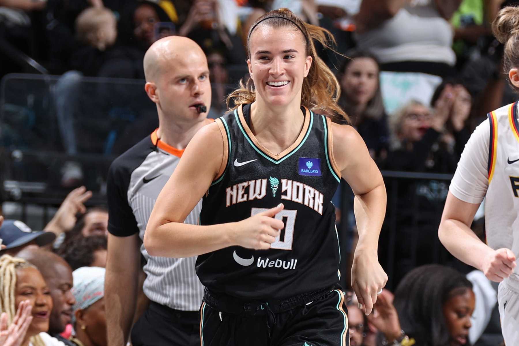 BROOKLYN, NY - MAY 18: Sabrina Ionescu #20 of the New York Liberty smiles during the game against the Indiana Fever on May 18, 2024 at Barclays Center in Brooklyn, New York. NOTE TO USER: User expressly acknowledges and agrees that, by downloading and or using this Photograph, user is consenting to the terms and conditions of the Getty Images License Agreement. Mandatory Copyright Notice: Copyright 2024 NBAE (Photo by Stephen Gosling/NBAE via Getty Images)
