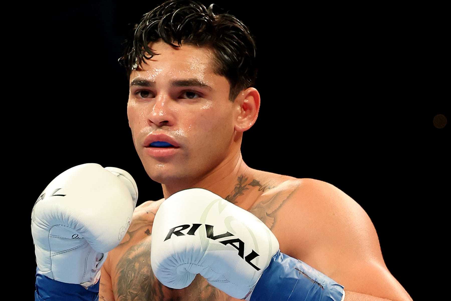 NEW YORK, NEW YORK - APRIL 20: Ryan Garcia (white trunks) prepares to fight Devin Haney during their WBC Super Lightweight title bout at Barclays Center on April 20, 2024 in New York City.  (Photo by Al Bello/Getty Images)