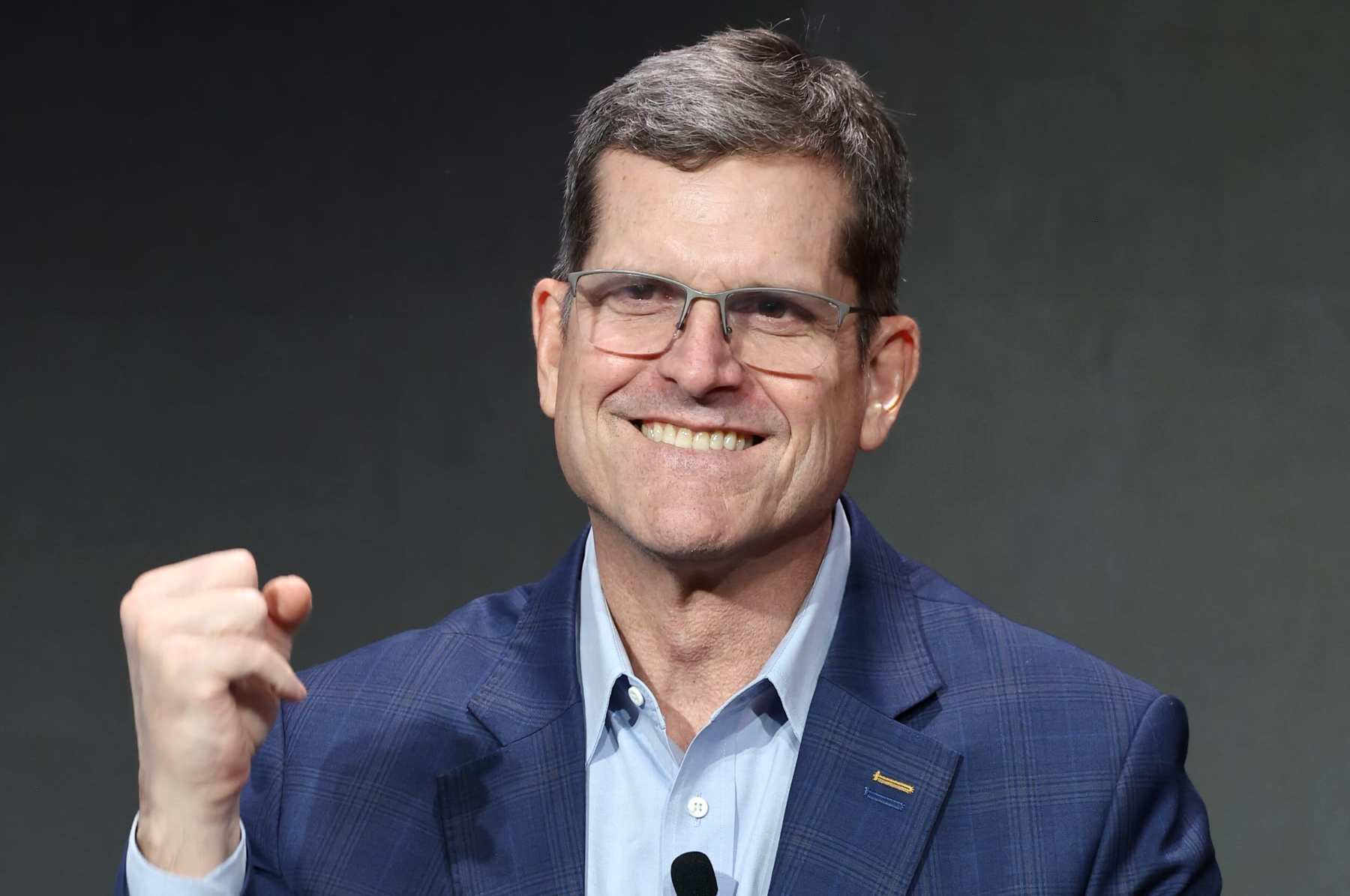 LAS VEGAS, NEVADA - FEBRUARY 09: Jim Harbaugh speaks onstage during Verizon’s press conference at Verizon Live at Super Bowl LVIII on February 09, 2024 in Las Vegas, Nevada. (Photo by Mike Coppola/Getty Images for Verizon)
