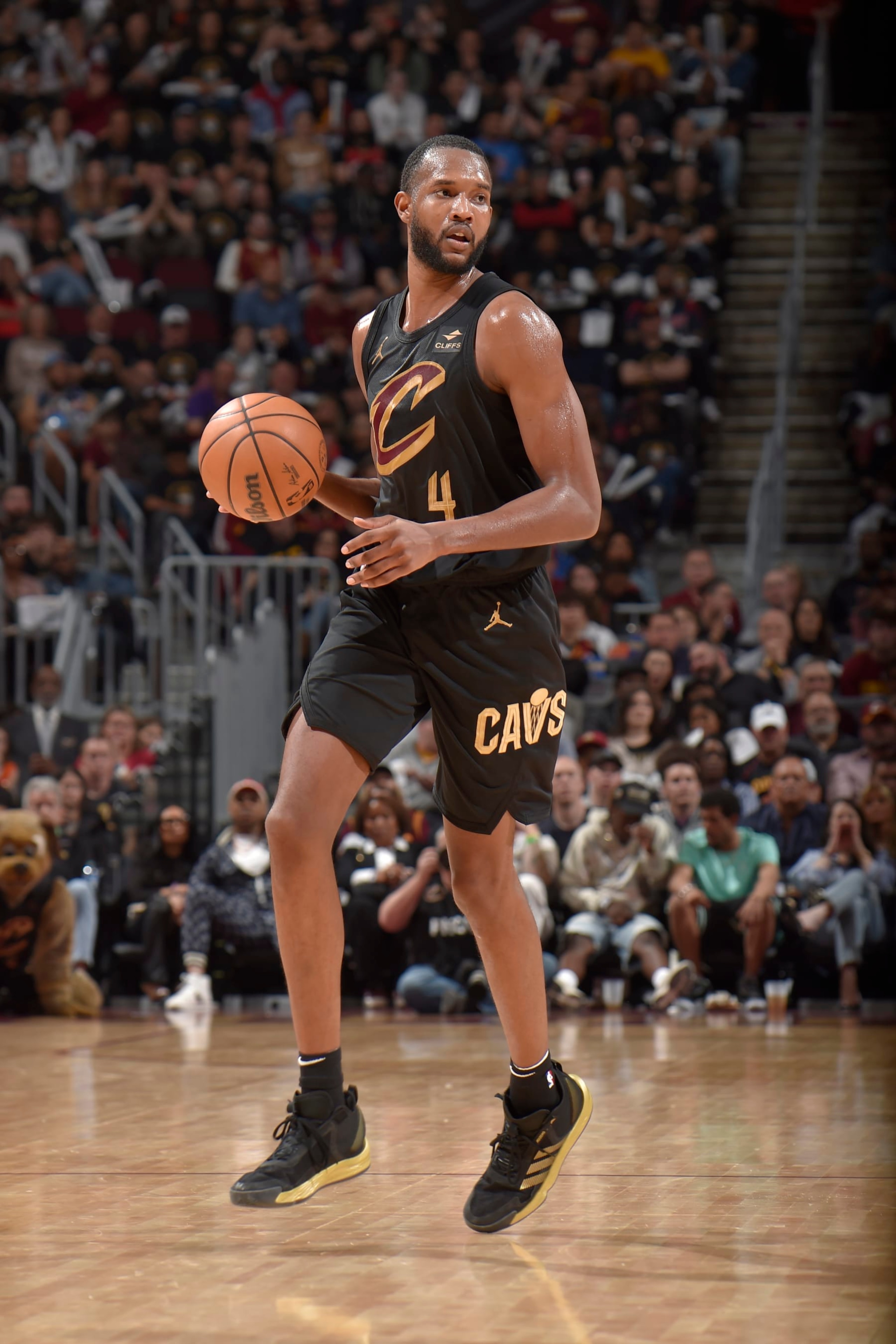 CLEVELAND, OH - APRIL 30: Evan Mobley #4 of the Cleveland Cavaliers handles the ball during the game against the Orlando Magic during Round 1 Game 5 of the 2024 NBA Playoffs on April 30, 2024 at Rocket Mortgage FieldHouse in Cleveland, Ohio. NOTE TO USER: User expressly acknowledges and agrees that, by downloading and/or using this Photograph, user is consenting to the terms and conditions of the Getty Images License Agreement. Mandatory Copyright Notice: Copyright 2024 NBAE (Photo by David Liam Kyle/NBAE via Getty Images)