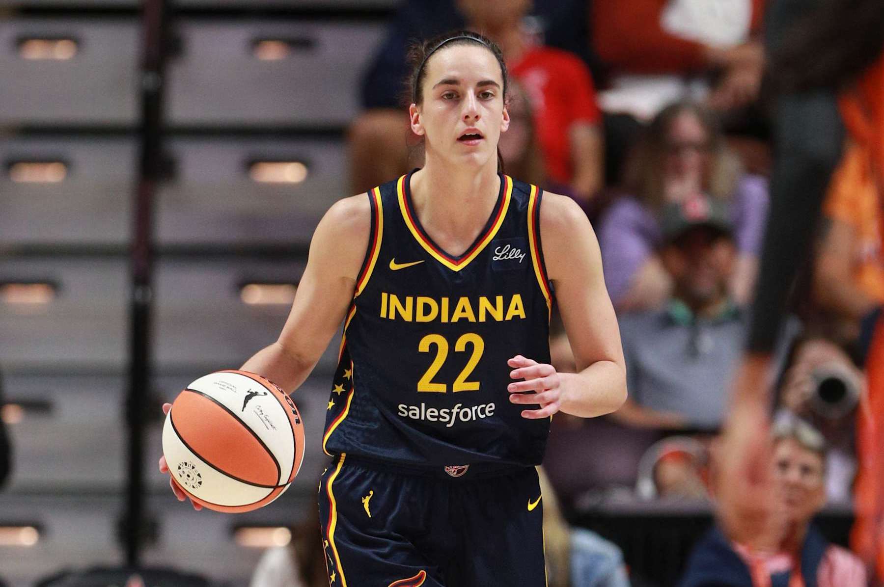 UNCASVILLE, CT - SEPTEMBER 22: Caitlin Clark #22 of the Indiana Fever dribbles the ball during the game against the Connecticut Sun during round one game one of the 2024 WNBA Playoffs on September 22, 2024 at the Mohegan Sun Arena in Uncasville, Connecticut. NOTE TO USER: User expressly acknowledges and agrees that, by downloading and or using this photograph, User is consenting to the terms and conditions of the Getty Images License Agreement. Mandatory Copyright Notice: Copyright 2024 NBAE (Photo by Chris Marion/NBAE via Getty Images)