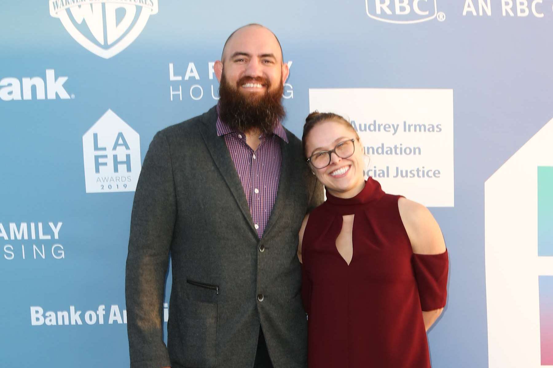 WEST HOLLYWOOD, CALIFORNIA - APRIL 25: MMA Fighter Travis Browne (L) and WWE Wrestler Ronda Rousey (R) attend the LA Family Housing Annual LAFH Awards and fundraiser celebration at The Lot on April 25, 2019 in West Hollywood, California. (Photo by Paul Archuleta/FilmMagic)