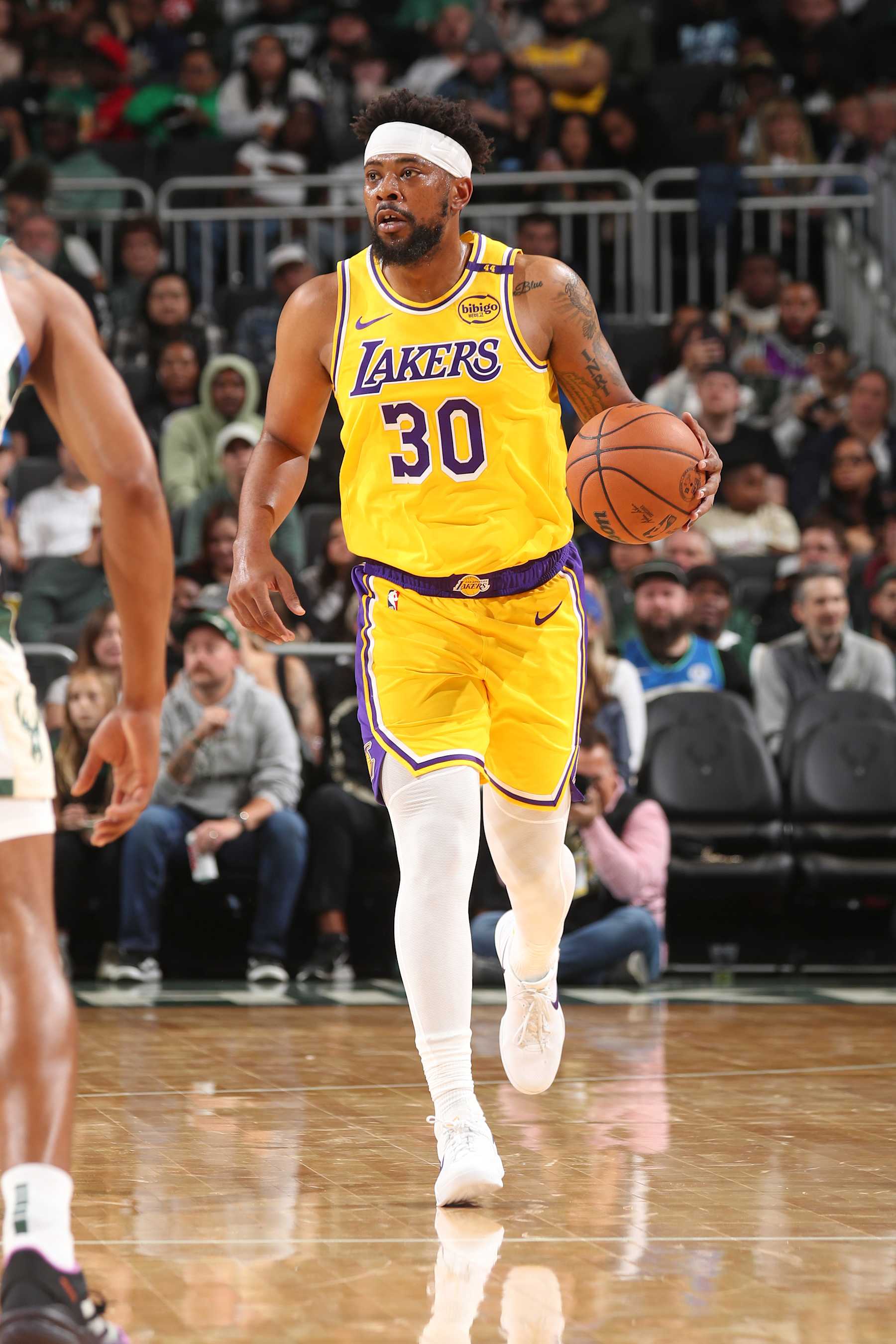 MILWAUKEE, WI - OCTOBER 10: Jordan Goodwin #30 of the Los Angeles Lakers dribbles the ball during the game against the Milwaukee Bucks during a preseason game on October 10, 2024 at Fiserv Forum Center in Milwaukee, Wisconsin. NOTE TO USER: User expressly acknowledges and agrees that, by downloading and or using this Photograph, user is consenting to the terms and conditions of the Getty Images License Agreement. Mandatory Copyright Notice: Copyright 2024 NBAE (Photo by Gary Dineen/NBAE via Getty Images).