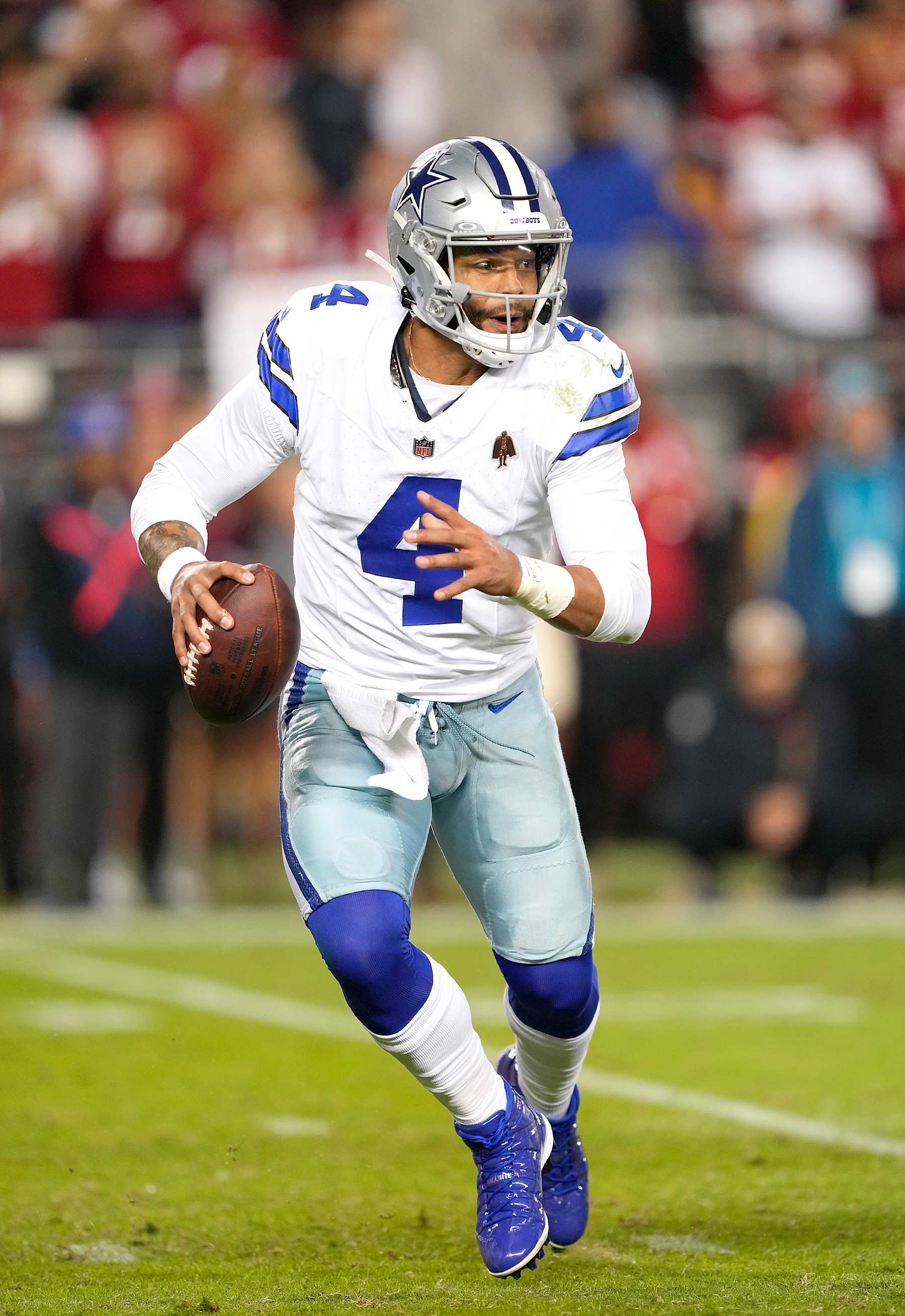 SANTA CLARA, CALIFORNIA - OCTOBER 27: Dak Prescott #4 of the Dallas Cowboys scrambling with the ball looking to pass against the San Francisco 49ers during the fourth quarter of an NFL football game at Levi's Stadium on October 27, 2024 in Santa Clara, California. (Photo by Thearon W. Henderson/Getty Images)