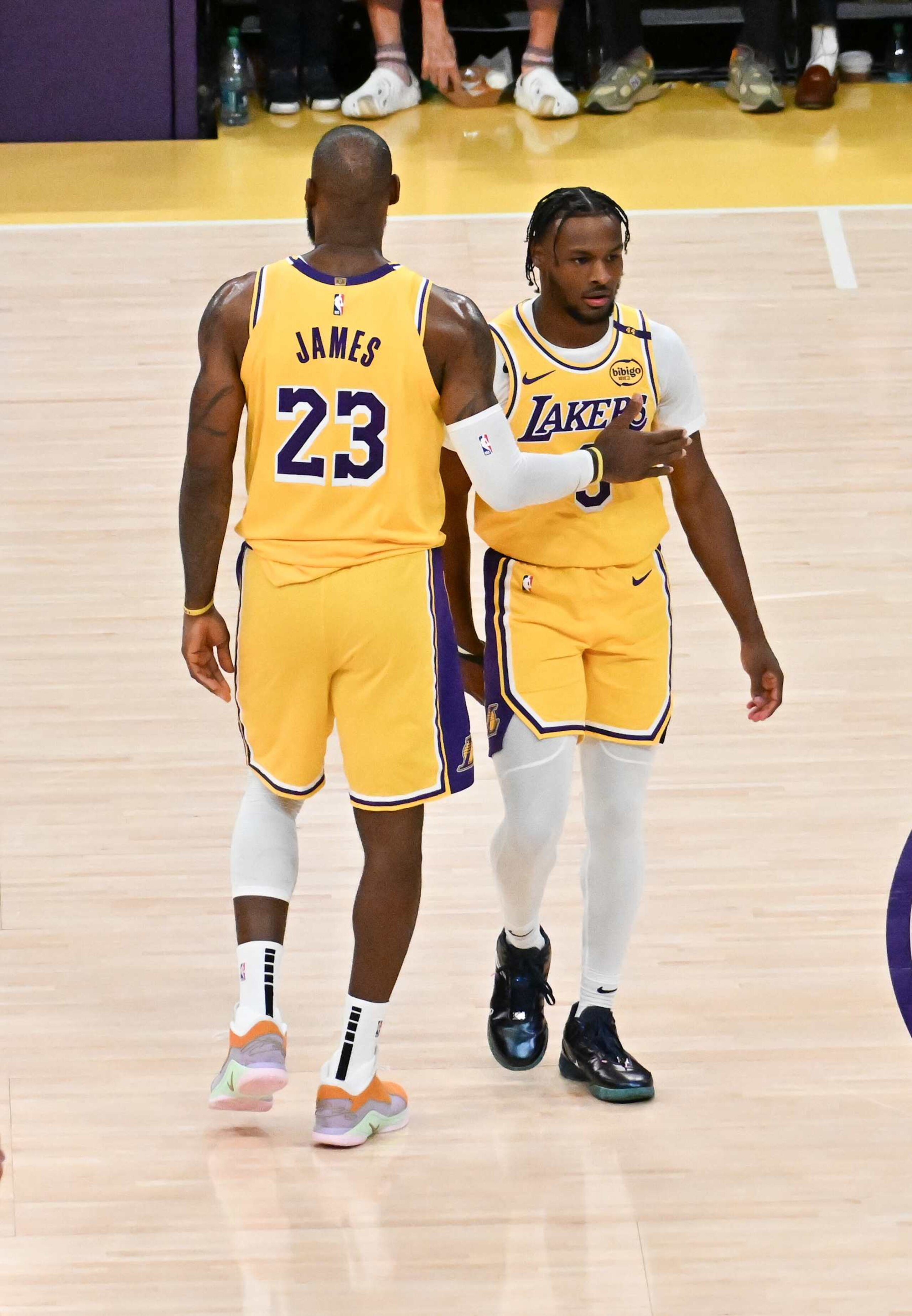 LOS ANGELES, CALIFORNIA - OCTOBER 22: LeBron James #23  and Bronny James #9 of the Los Angeles Lakers on the court for the first time during the game against the Minnesota Timberwolves at Crypto.com Arena on October 22, 2024 in Los Angeles, California. NOTE TO USER: User expressly acknowledges and agrees that, by downloading and or using this photograph, User is consenting to the terms and conditions of the Getty Images License Agreement. (Photo by Allen Berezovsky/Getty Images)