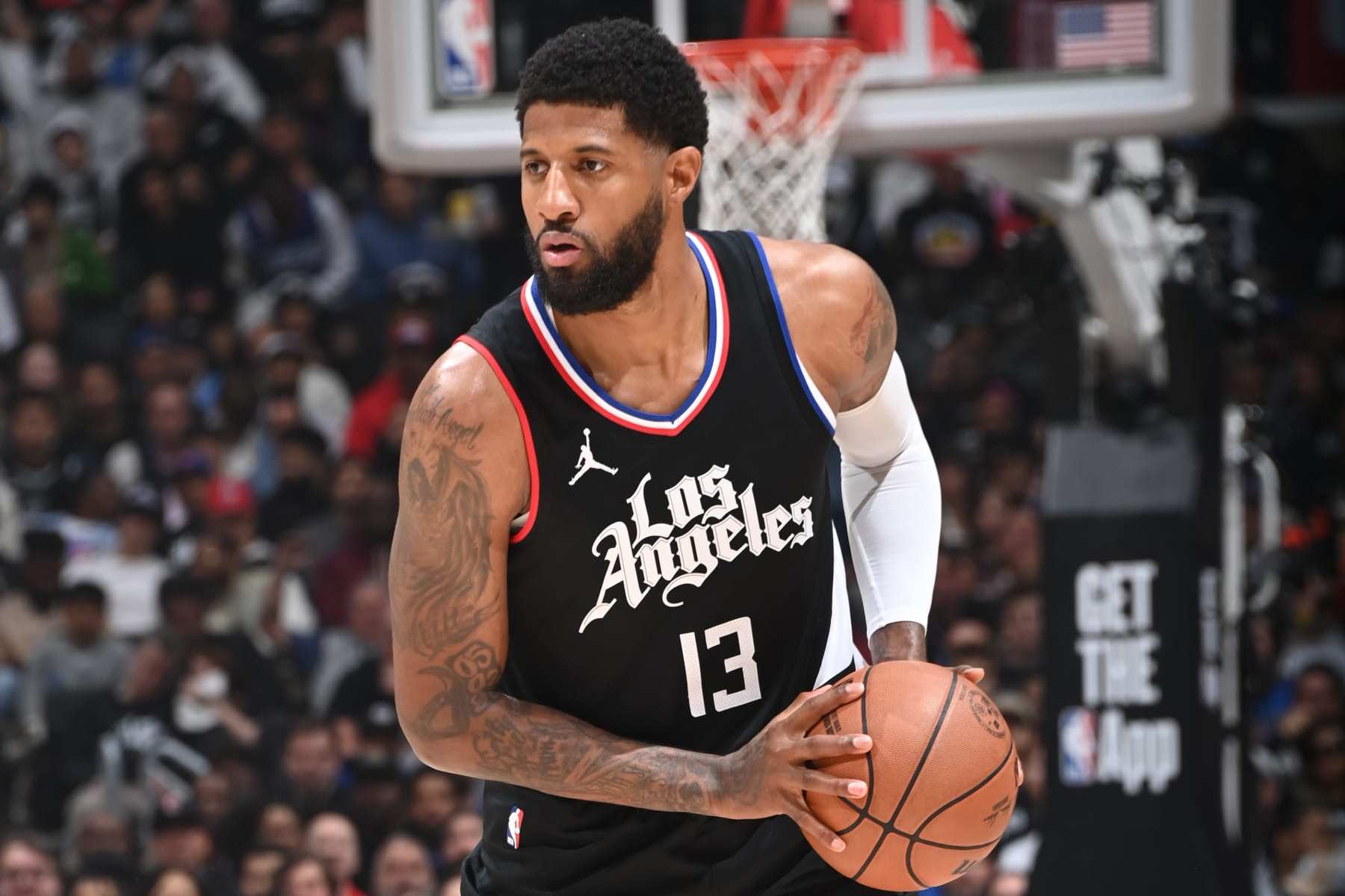 LOS ANGELES, CA - APRIL 23: Paul George #13 of the LA Clippers handles the ball during the game against the Dallas Mavericks during Round 1 Game 2 of the 2024 NBA Playoffs on April 23, 2024 at Crypto.Com Arena in Los Angeles, California. NOTE TO USER: User expressly acknowledges and agrees that, by downloading and/or using this Photograph, user is consenting to the terms and conditions of the Getty Images License Agreement. Mandatory Copyright Notice: Copyright 2024 NBAE (Photo by Andrew D. Bernstein/NBAE via Getty Images)
