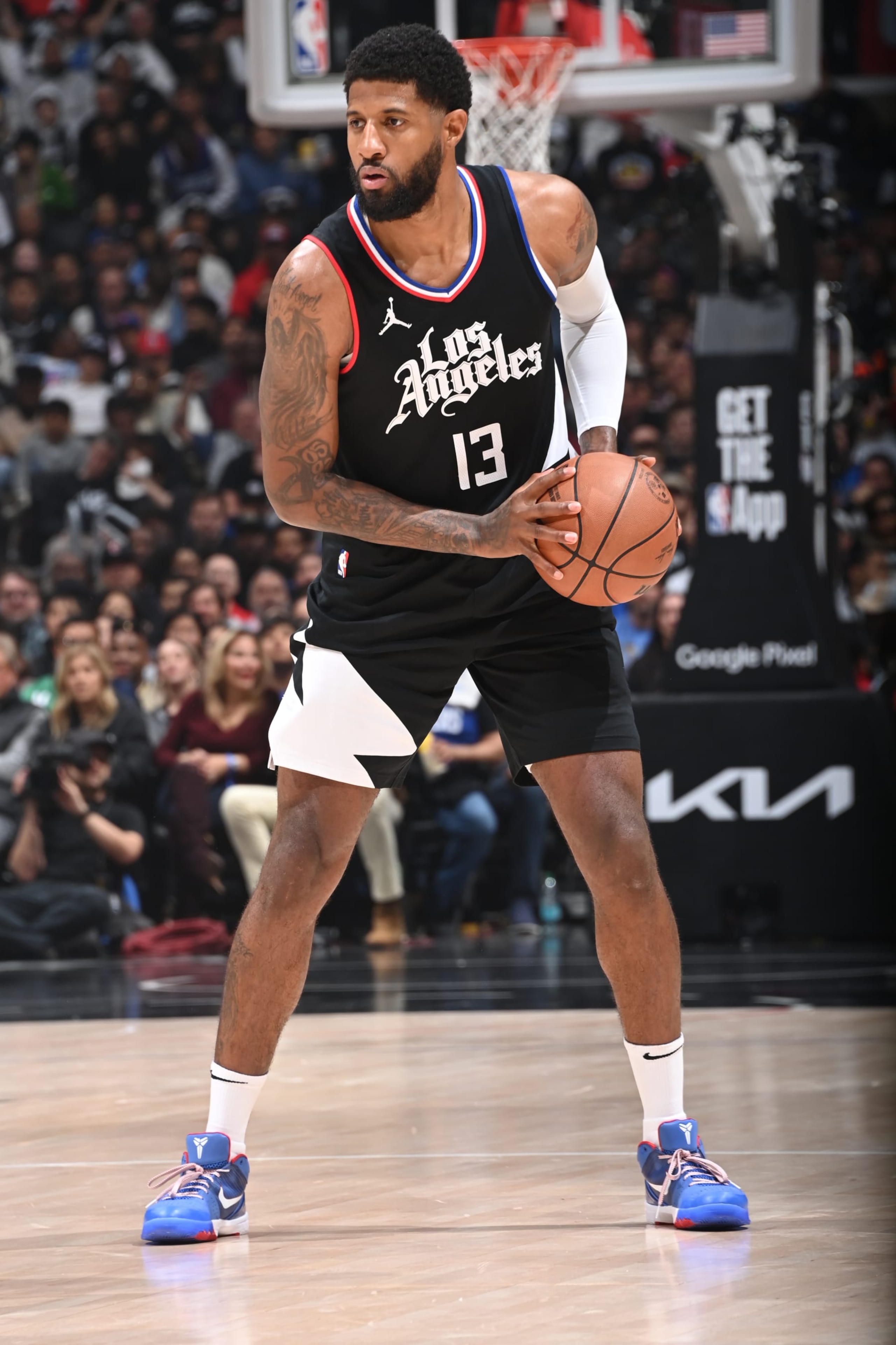 LOS ANGELES, CA - APRIL 23: Paul George #13 of the LA Clippers handles the ball during the game against the Dallas Mavericks during Round 1 Game 2 of the 2024 NBA Playoffs on April 23, 2024 at Crypto.Com Arena in Los Angeles, California. NOTE TO USER: User expressly acknowledges and agrees that, by downloading and/or using this Photograph, user is consenting to the terms and conditions of the Getty Images License Agreement. Mandatory Copyright Notice: Copyright 2024 NBAE (Photo by Andrew D. Bernstein/NBAE via Getty Images)