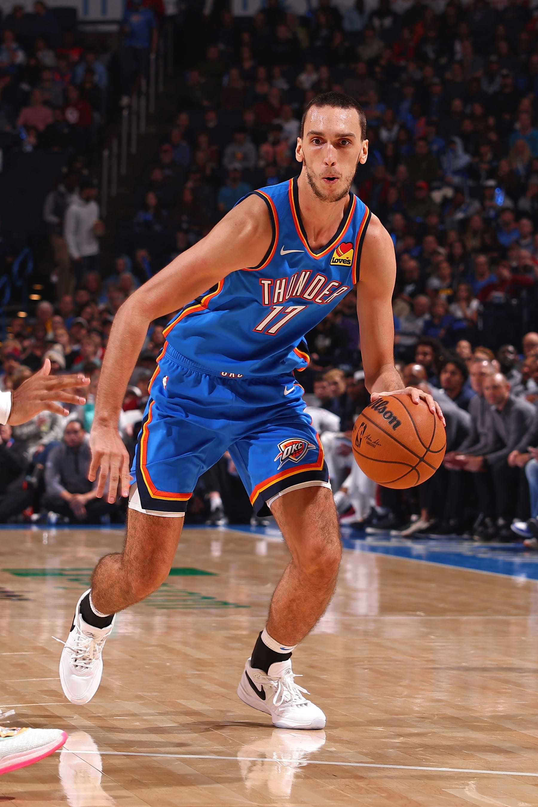OKLAHOMA CITY, OK - OCTOBER 29: Aleksej Pokusevski #17 of the Oklahoma City Thunder dribbles the ball during the game against the Denver Nuggets on October 29, 2023 at Paycom Center in Oklahoma City, Oklahoma. NOTE TO USER: User expressly acknowledges and agrees that, by downloading and or using this photograph, User is consenting to the terms and conditions of the Getty Images License Agreement. Mandatory Copyright Notice: Copyright 2023 NBAE (Photo by Zach Beeker/NBAE via Getty Images)