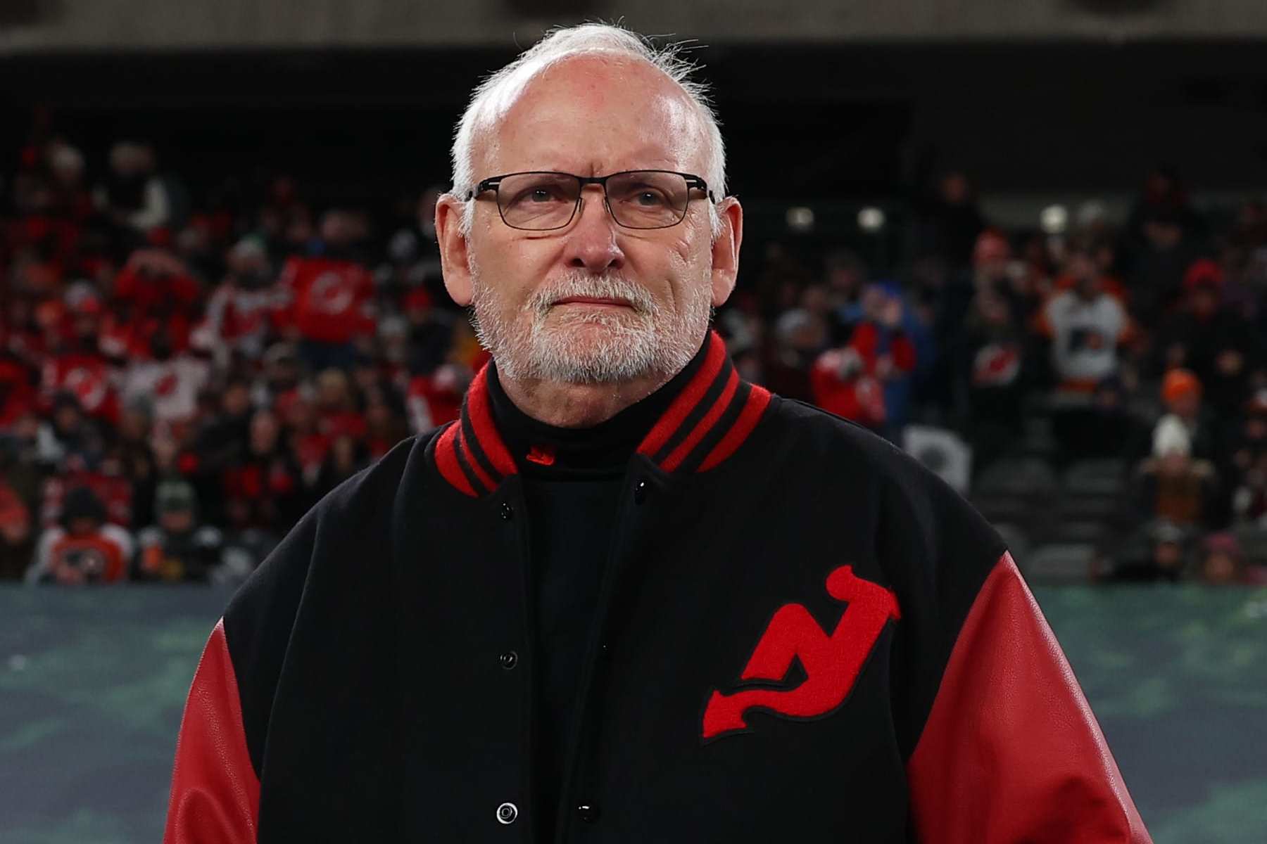 EAST RUTHERFORD, NJ - FEBRUARY 17:  Lindy Ruff head coach of the New Jersey Devils walks out to the bench prior to the 2024 Navy Federal Credit Union Stadium Series game against the New Jersey Devils at MetLife Stadium on February 17, 2024 in East Rutherford, New Jersey.  (Photo by Rich Graessle/NHLI via Getty Images)