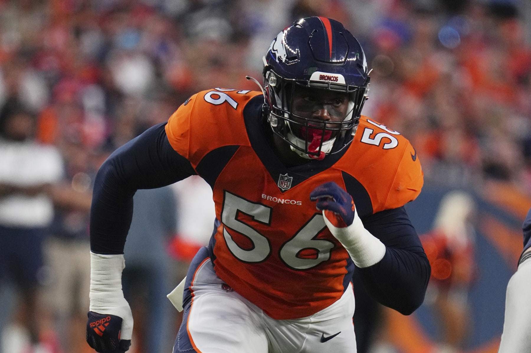 Denver Broncos linebacker Baron Browning (56) runs a play against