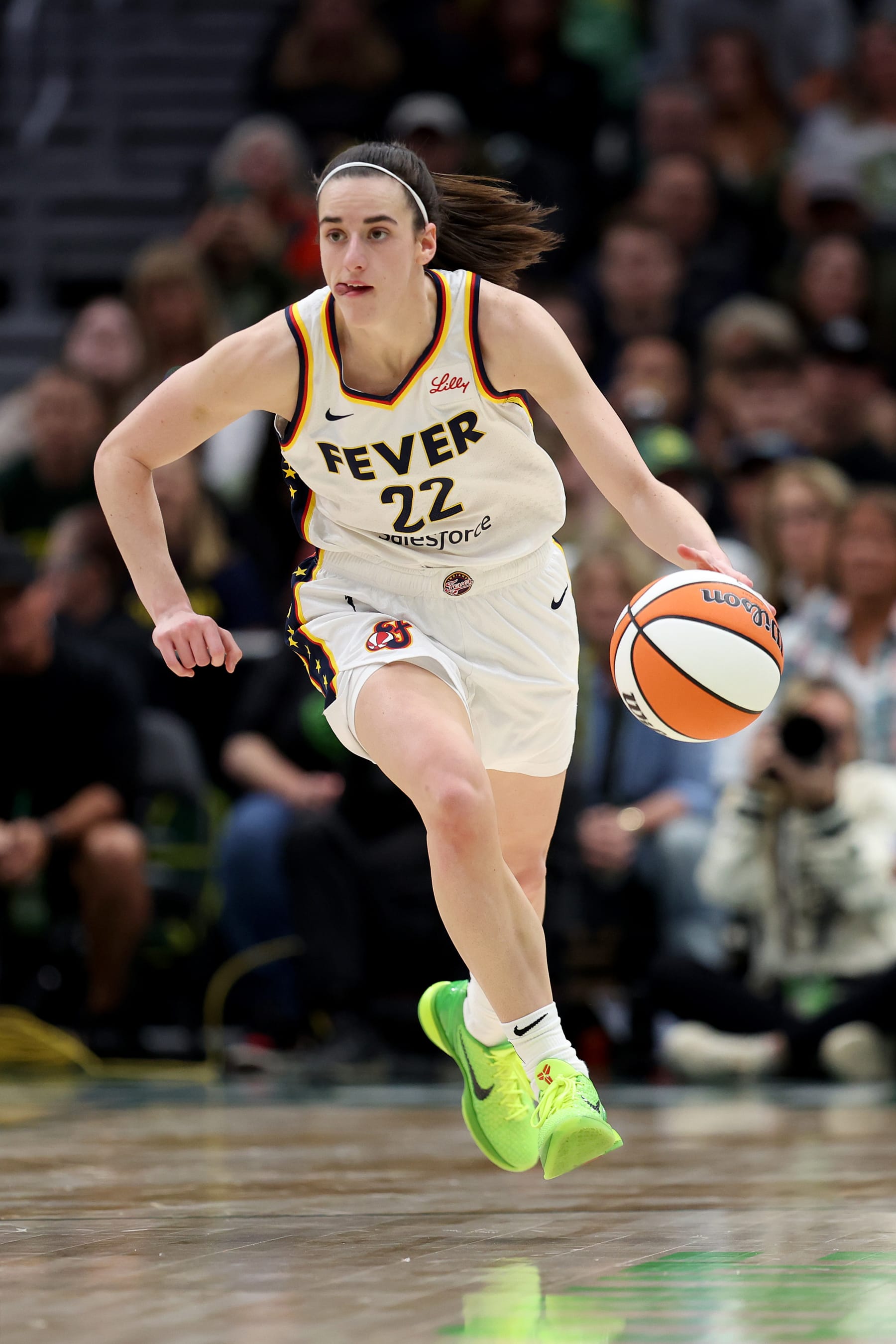 SEATTLE, WASHINGTON - JUNE 27: Caitlin Clark #22 of the Indiana Fever dribbles during the second quarter against the Seattle Storm at Climate Pledge Arena on June 27, 2024 in Seattle, Washington. NOTE TO USER: User expressly acknowledges and agrees that, by downloading and or using this photograph, User is consenting to the terms and conditions of the Getty Images License Agreement. (Photo by Steph Chambers/Getty Images)
