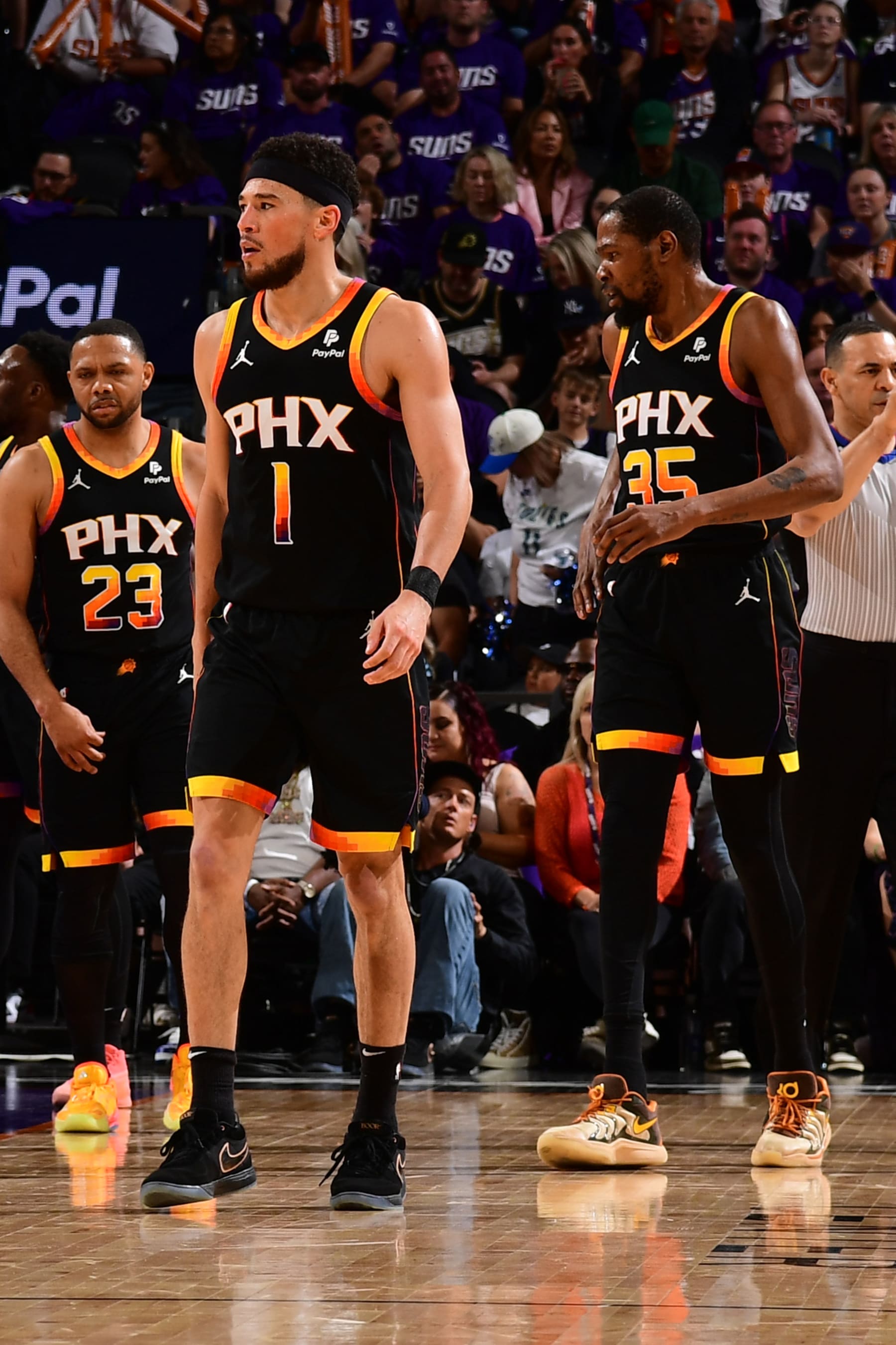 PHOENIX, AZ - APRIL  28: Devin Booker #1 of the Phoenix Suns and Kevin Durant #35 look on during the game against the Minnesota Timberwolves during Round 1 Game 4 of the 2024 NBA Playoffs on April 28, 2024 at Footprint Center in Phoenix, Arizona. NOTE TO USER: User expressly acknowledges and agrees that, by downloading and or using this photograph, user is consenting to the terms and conditions of the Getty Images License Agreement. Mandatory Copyright Notice: Copyright 2024 NBAE (Photo by Kate Frese/NBAE via Getty Images)
