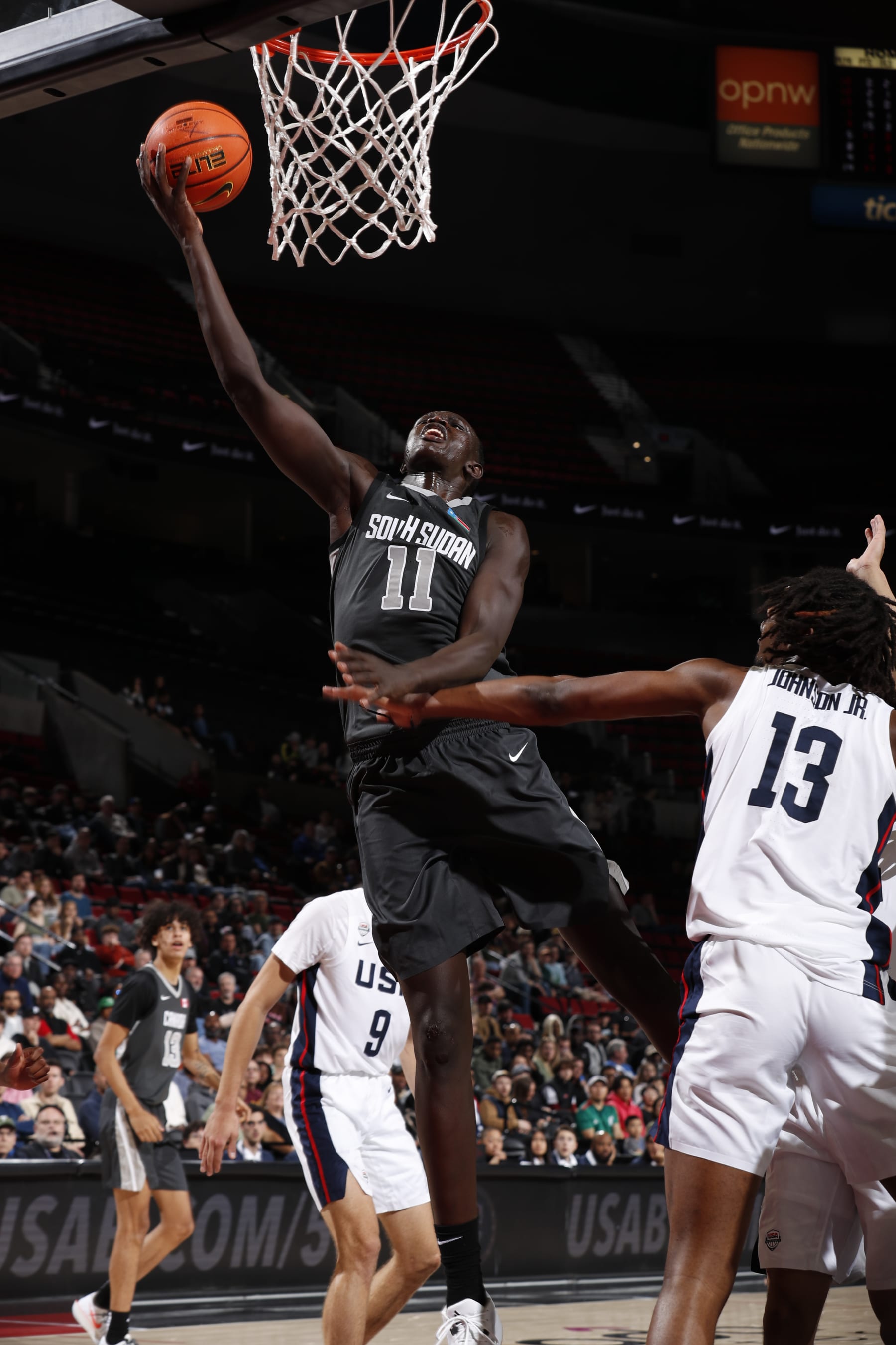 PORTLAND, OR - APRIL 13: Khaman Maluach #11 of Team World drives to the basket during the game against Team USA during the 2024 Nike Hoop Summit on April 13, 2024 at the Moda Center Arena in Portland, Oregon. NOTE TO USER: User expressly acknowledges and agrees that, by downloading and or using this photograph, user is consenting to the terms and conditions of the Getty Images License Agreement. Mandatory Copyright Notice: Copyright 2024 NBAE (Photo by Cameron Browne/NBAE via Getty Images)