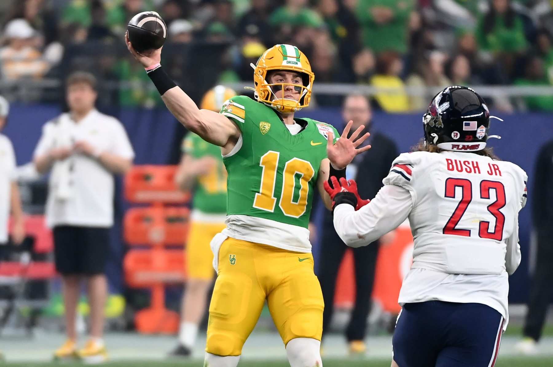 GLENDALE, ARIZONA - JANUARY 01: Bo Nix #10 of the Oregon Ducks throws the ball against the Liberty Flames during the 2023 Vrbo Fiesta Bowl game at State Farm Stadium on January 01, 2024 in Glendale, Arizona. (Photo by Norm Hall/Getty Images)