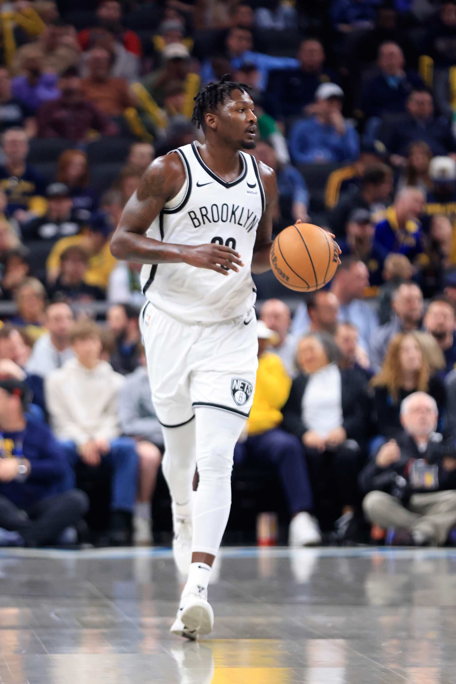 INDIANAPOLIS, INDIANA - MARCH 16: Dorian Finney-Smith #28 of the Brooklyn Nets  brings the ball up the court in the game against the Indiana Pacers at Gainbridge Fieldhouse on March 16, 2024 in Indianapolis, Indiana. NOTE TO USER: User expressly acknowledges and agrees that, by downloading and or using this photograph, User is consenting to the terms and conditions of the Getty Images License Agreement. (Photo by Justin Casterline/Getty Images)
