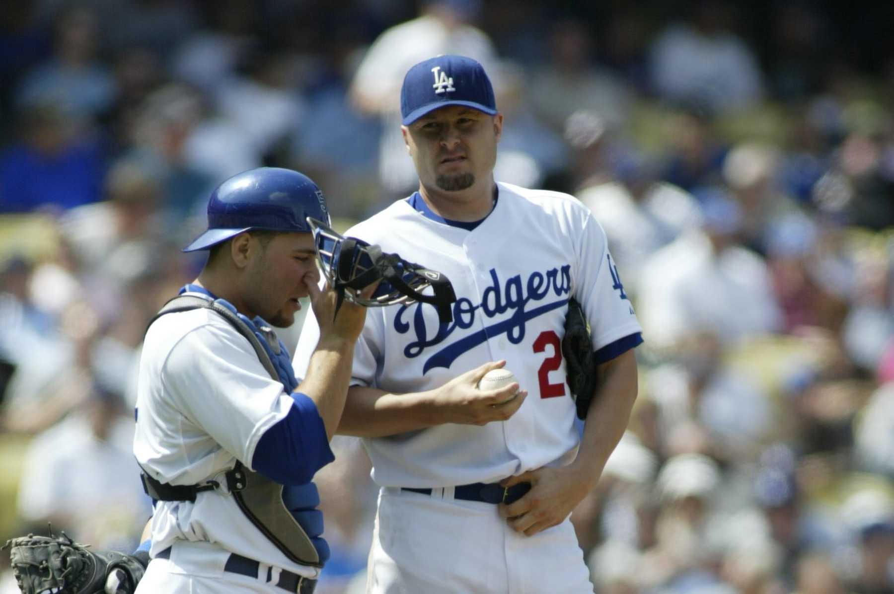 LOS ANGELES - APRIL 9: Jason Schmidt and Russell Martin of the Los Angeles Dodgers talk on the mound during the game against the Colorado Rockies at Dodger Stadium in Los Angeles, California on April 9, 2007. The Rockies defeated the Dodgers 6-3. (Photo by Rob Leiter/MLB via Getty Images)