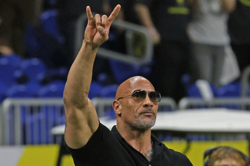 SAN ANTONIO, TX - FEBRUARY 19: Dwayne Johnson, co-owner of the XFL, acknowledges the crowd before the start of the game between the San Antonio Brahamas and the St. Louis Battlehawks at the Alamodome on February 19, 2023 in San Antonio, Texas.  (Photo by Ronald Cortes/Getty Images)