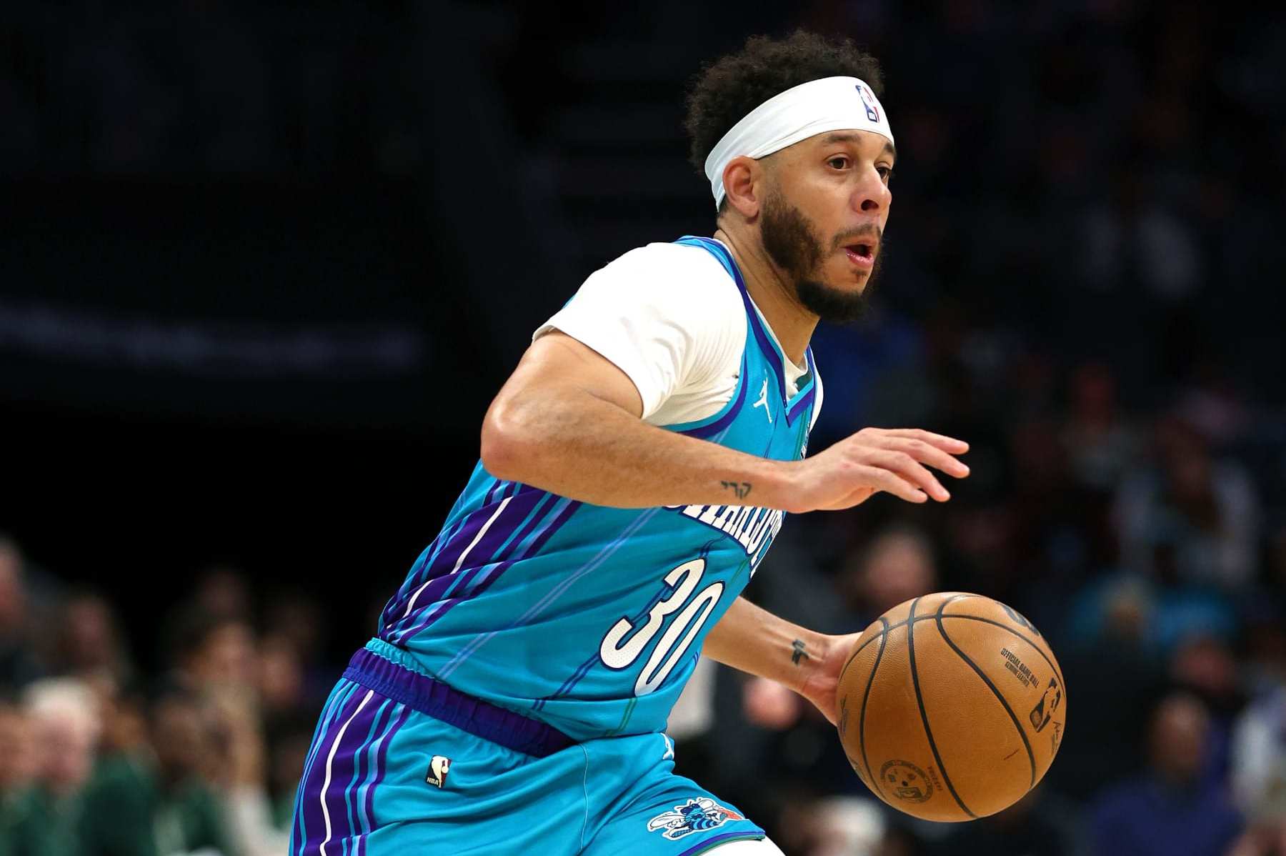 CHARLOTTE, NORTH CAROLINA - FEBRUARY 29: Seth Curry #30 of the Charlotte Hornets dribbles during the first half of the game against the Milwaukee Bucks at Spectrum Center on February 29, 2024 in Charlotte, North Carolina. NOTE TO USER: User expressly acknowledges and agrees that, by downloading and or using this photograph, User is consenting to the terms and conditions of the Getty Images License Agreement. (Photo by Jared C. Tilton/Getty Images)