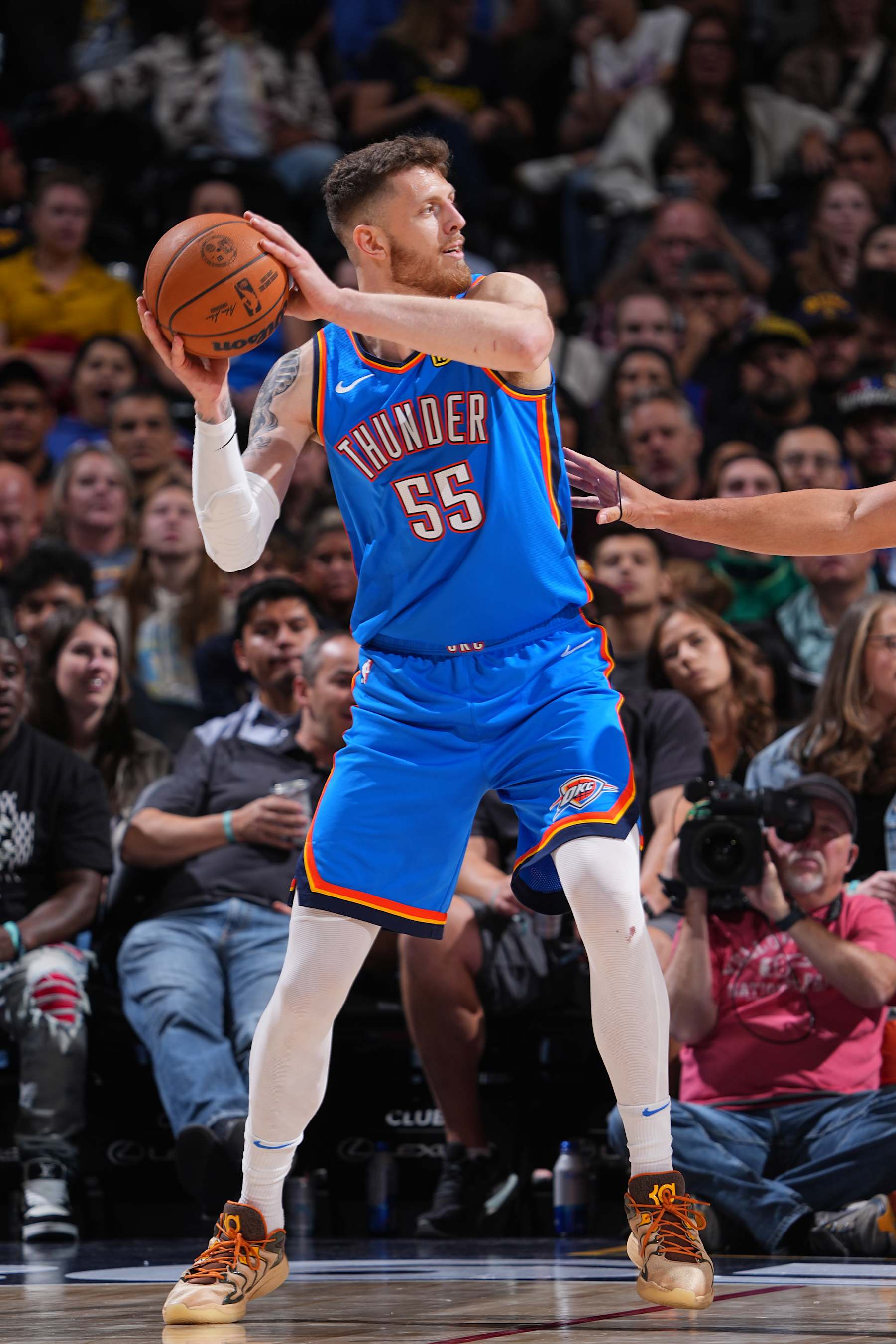 DENVER, CO - OCTOBER 15: Isaiah Hartenstein #55 of the Oklahoma City Thunder handles the ball during the game against the Denver Nuggets during a NBA preseason game on October 15, 2024 at Ball Arena in Denver, Colorado. NOTE TO USER: User expressly acknowledges and agrees that, by downloading and/or using this Photograph, user is consenting to the terms and conditions of the Getty Images License Agreement. Mandatory Copyright Notice: Copyright 2024 NBAE (Photo by Garrett Ellwood/NBAE via Getty Images)
