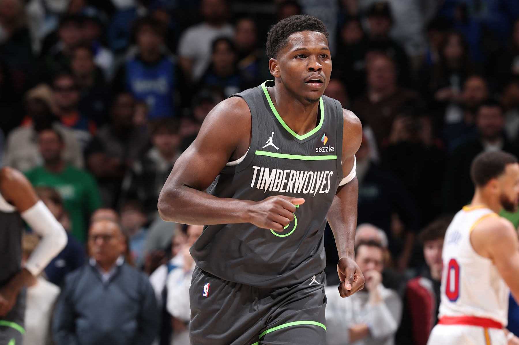 MINNEAPOLIS, MN -  DECEMBER 21: Anthony Edwards #5 of the Minnesota Timberwolves looks on during the game against the Golden State Warriors on December 21, 2024 at Target Center in Minneapolis, Minnesota. NOTE TO USER: User expressly acknowledges and agrees that, by downloading and or using this Photograph, user is consenting to the terms and conditions of the Getty Images License Agreement. Mandatory Copyright Notice: Copyright 2024 NBAE (Photo by David Sherman/NBAE via Getty Images)