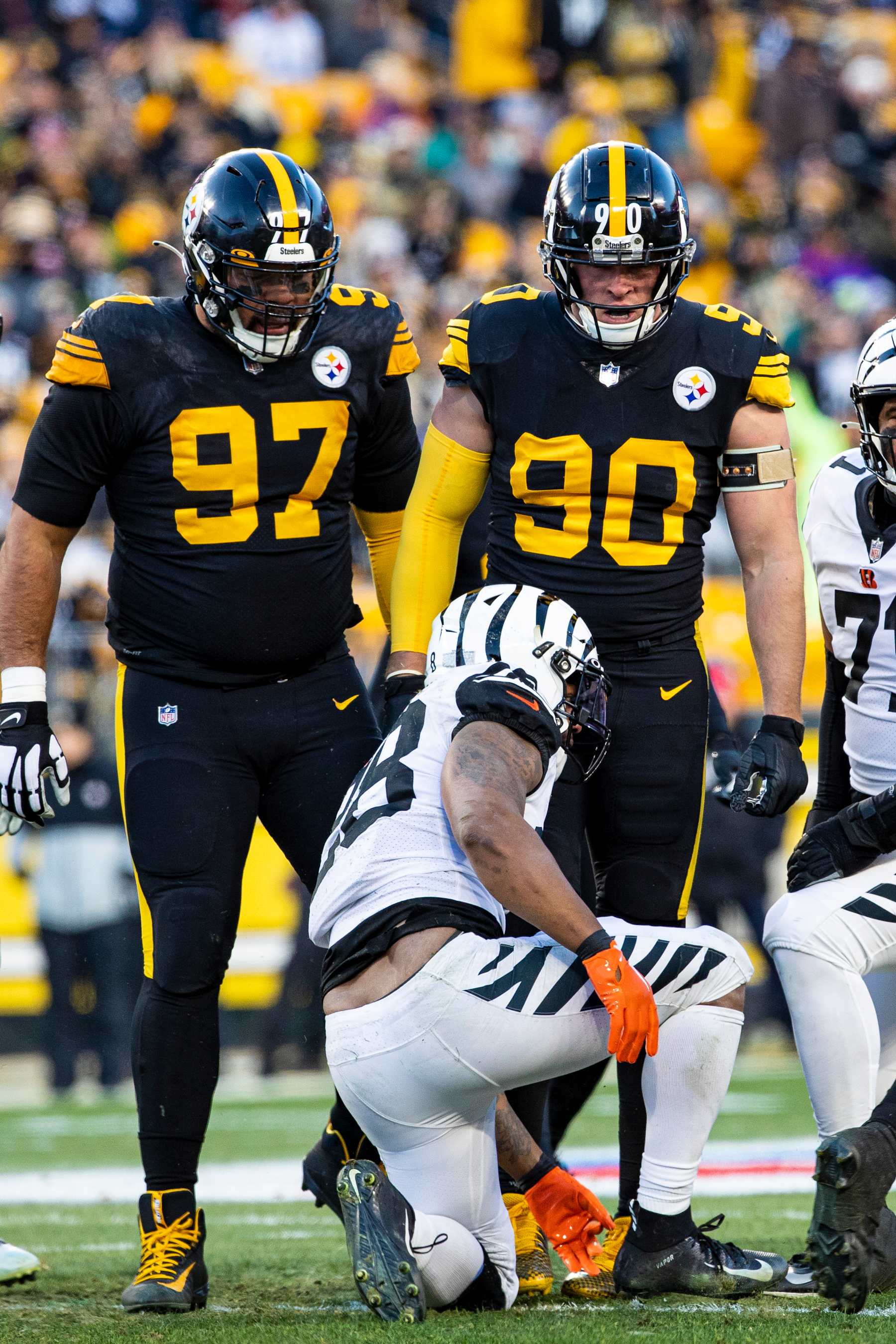 Pittsburgh Steelers defenders Cameron Heyward (left) and T.J. Watt (right)